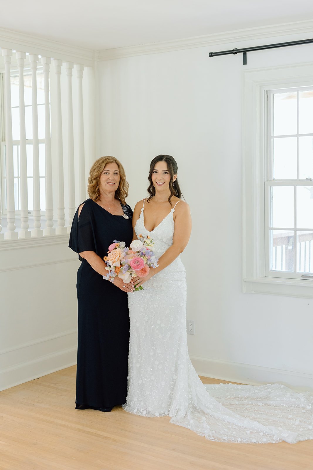  Bride and her mother share a moment while getting ready at Willowfarm House NOTL. 