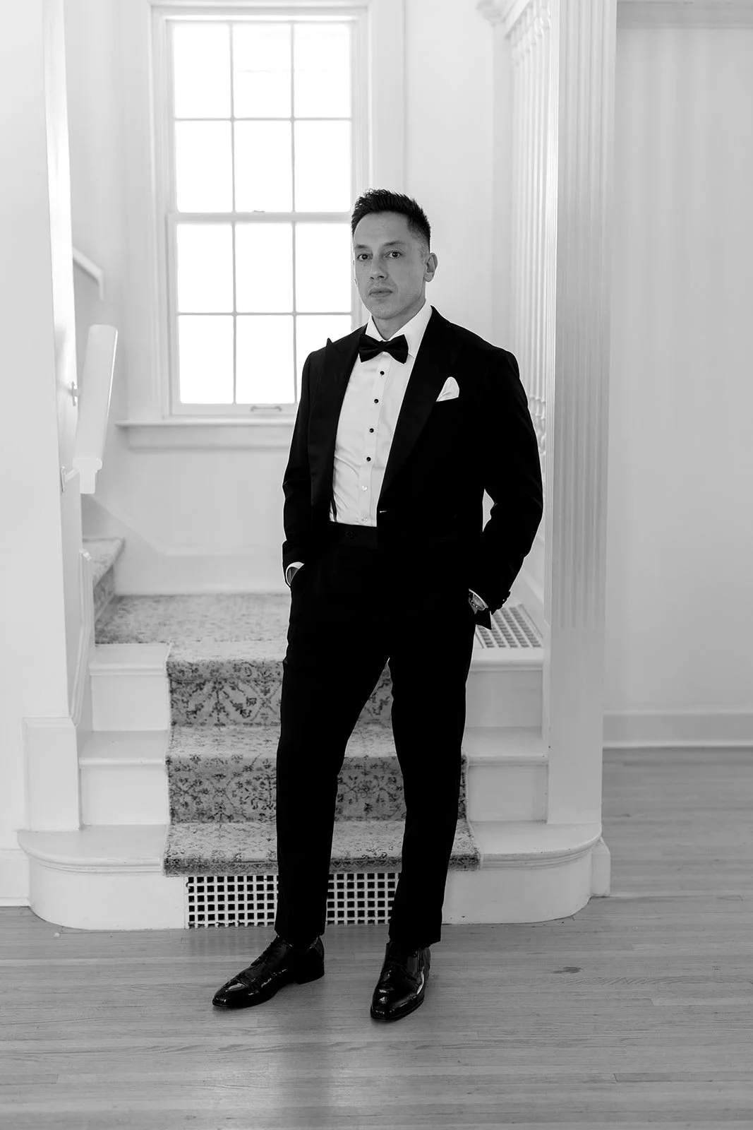  Black and white portrait of a groom at a wedding in Niagara-on-the-Lake. 