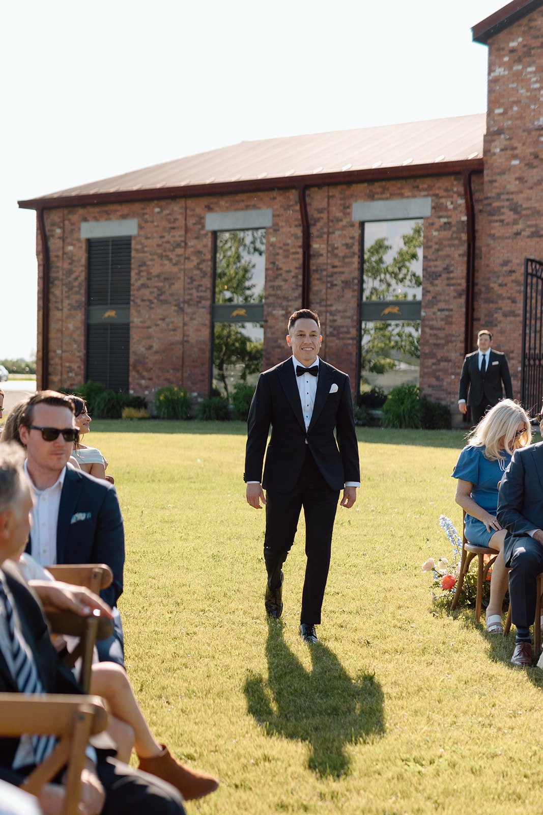  Groom walking down aisle to meet his bride underneath the Chuppah. 