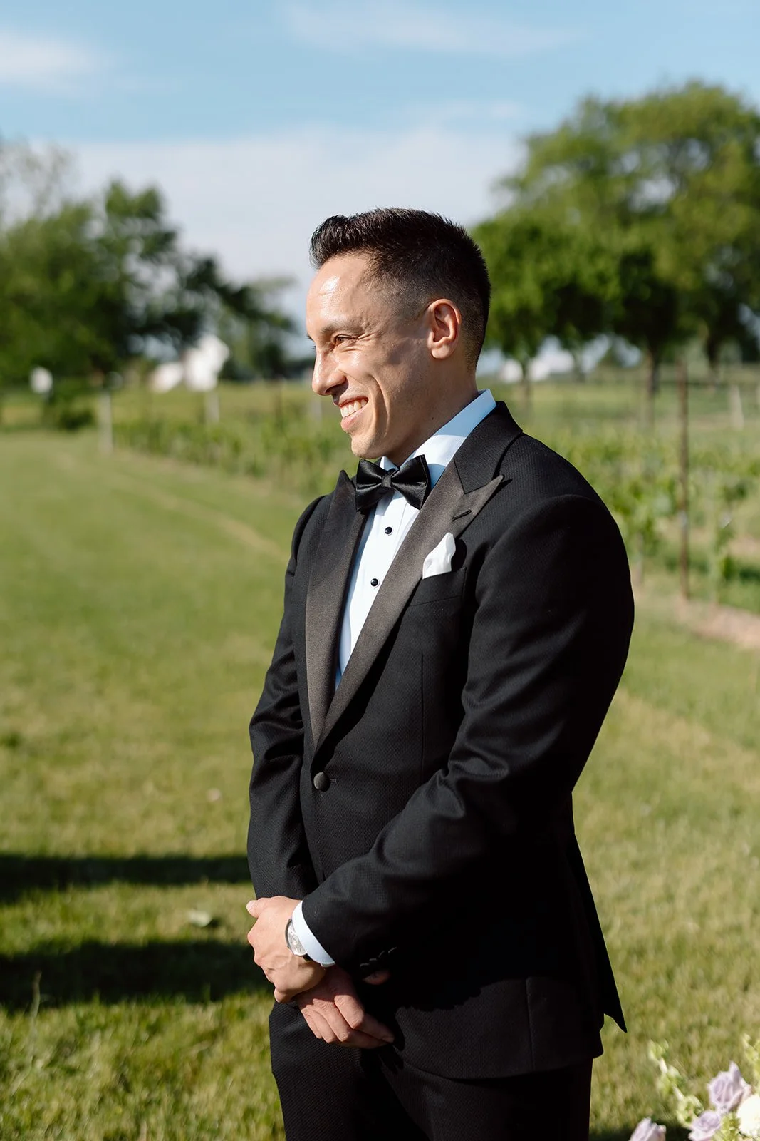  Grooms awaits the arrival of his bride at the alter. The Hare Wine Co vineyard. 