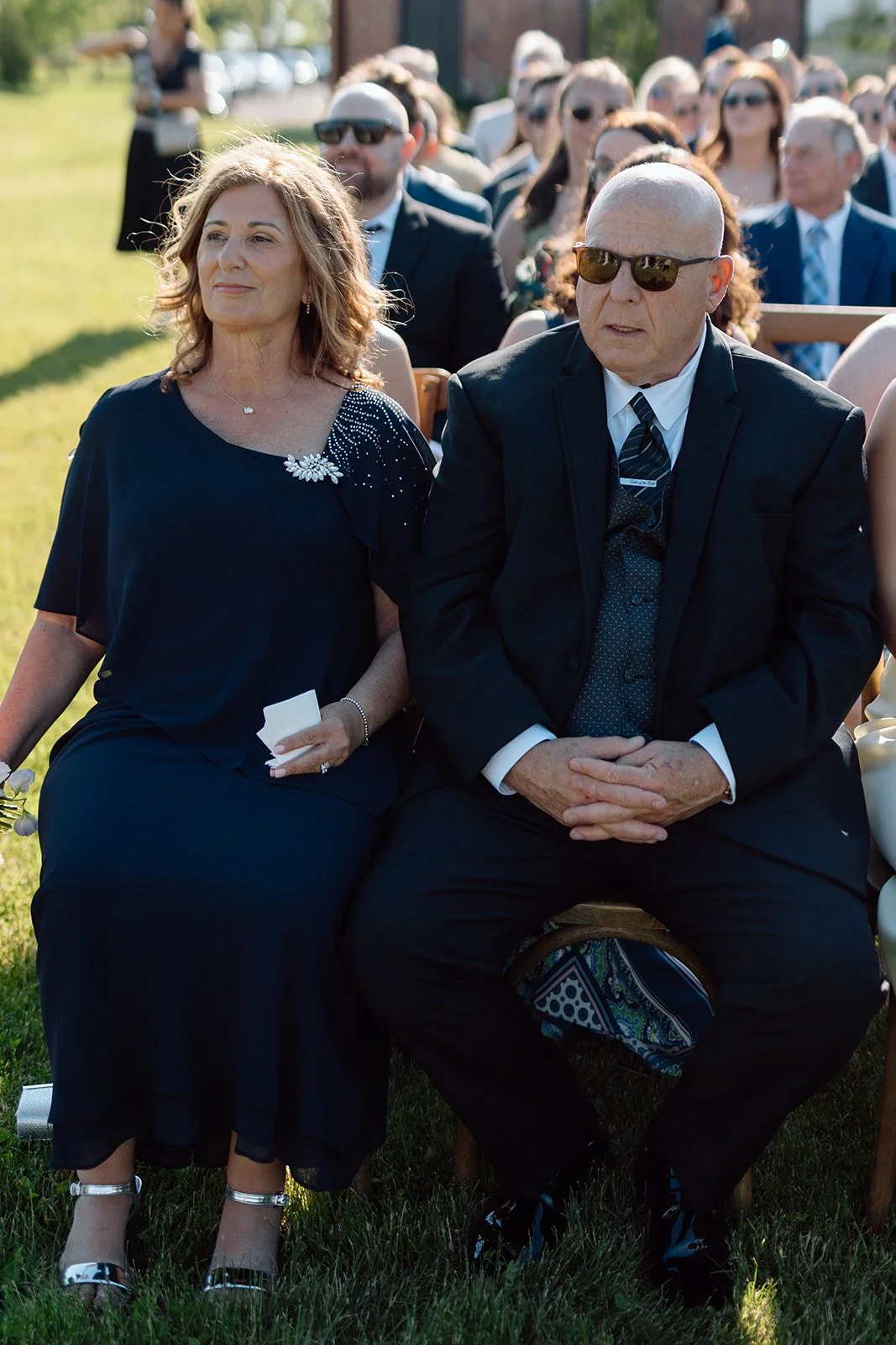  Mother and father on look the ceremony of their daughter, marring her highschool sweetheart. Vineyard at The Hare Wine Co. 