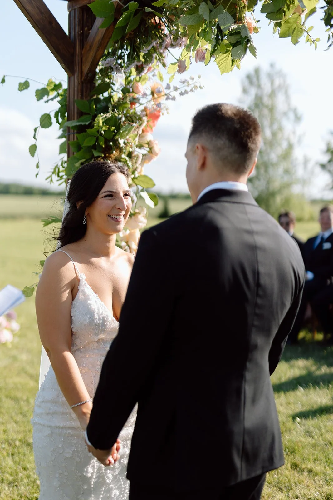  Bride and Groom stand under the chuppah during their ceremony and vow exchange while they share this moment with family and friends. Ceremony hosted in vineyard at The Hare Wine Co. 