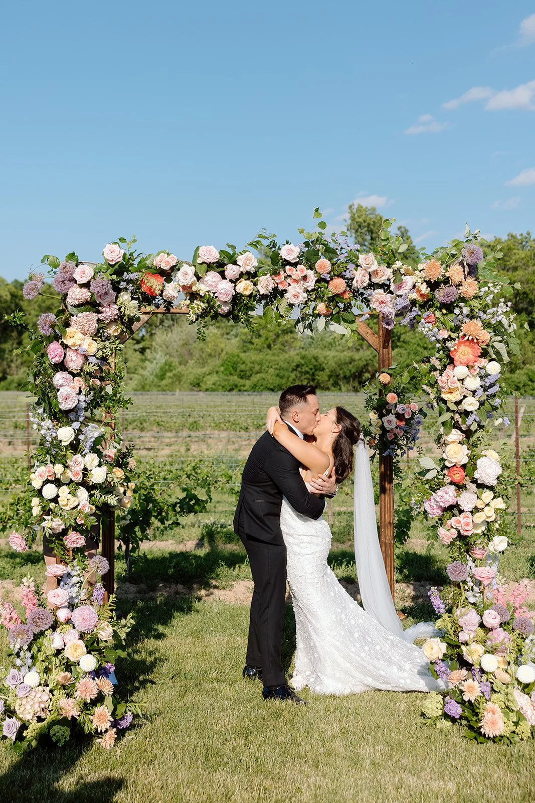  Bride and Groom share their first kiss married, under the Chuppah within the vineyards at The Hare Wine Co. in Niagara on the Lake. 