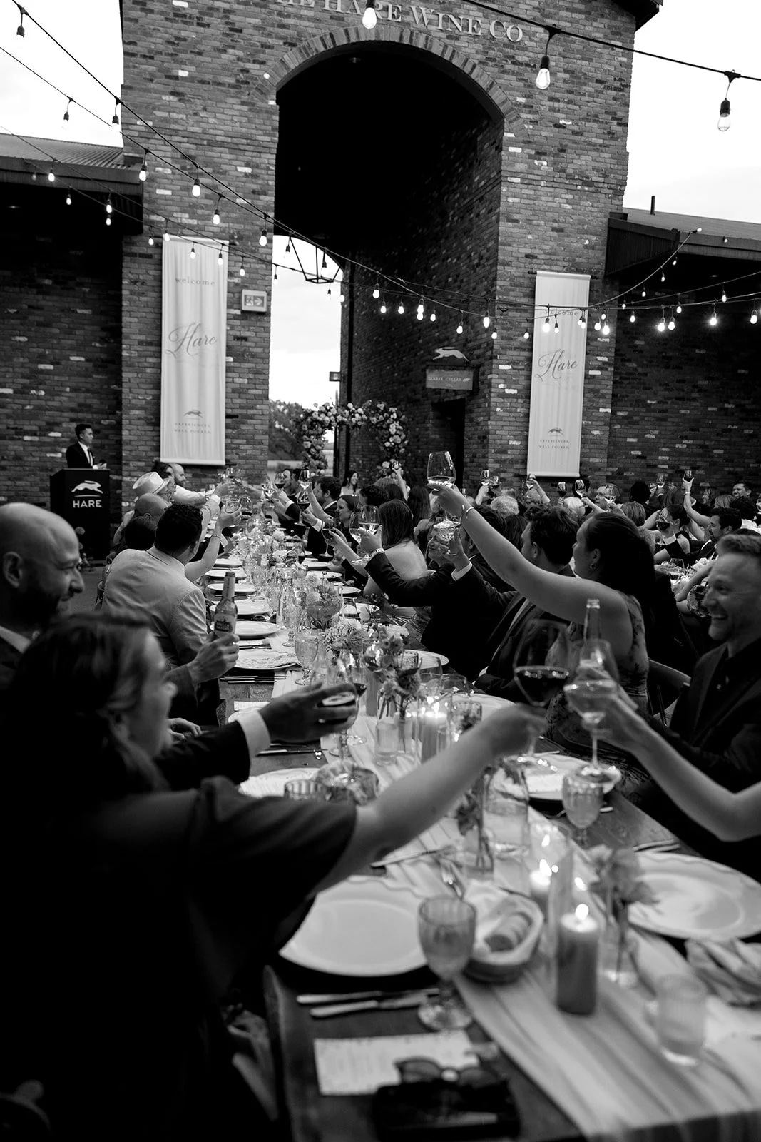  Guest cheers to the couple during dinner at The Hare Wine Co. 