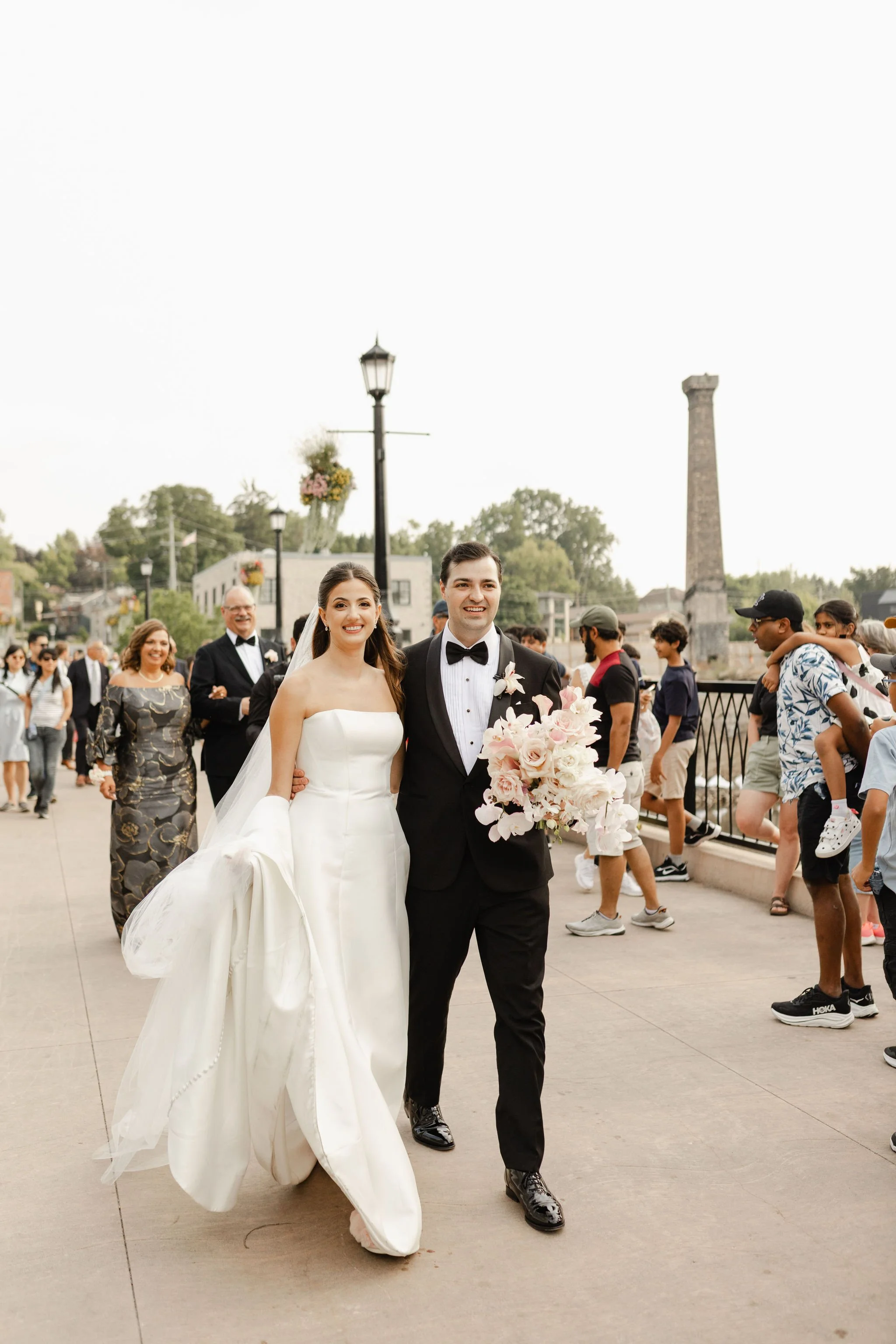 Bride and Groom share an intimate moment post ceremony welcoming Guests to Elora Mill.