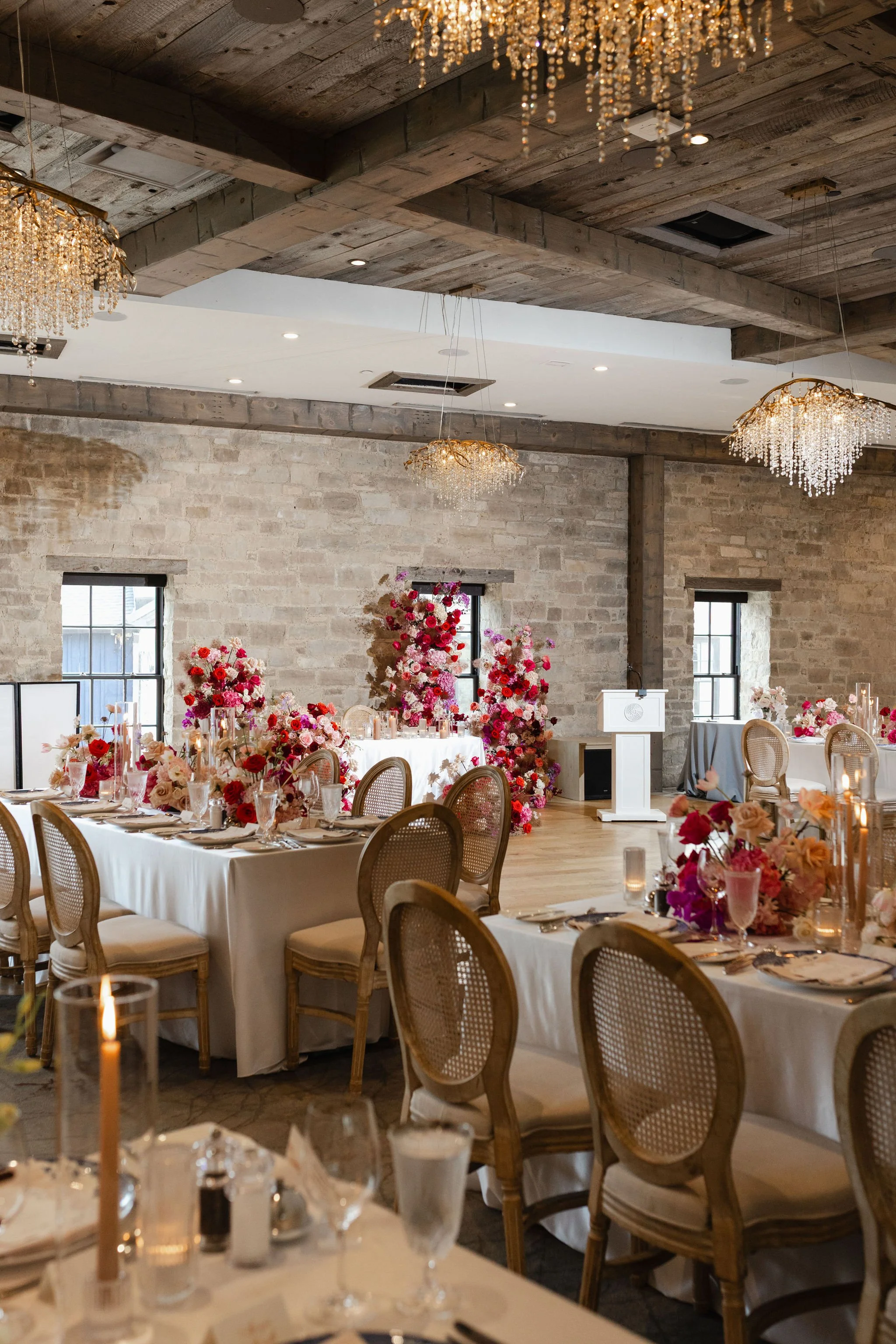 Elora Mill Wedding with a hot pink and red floral design.
