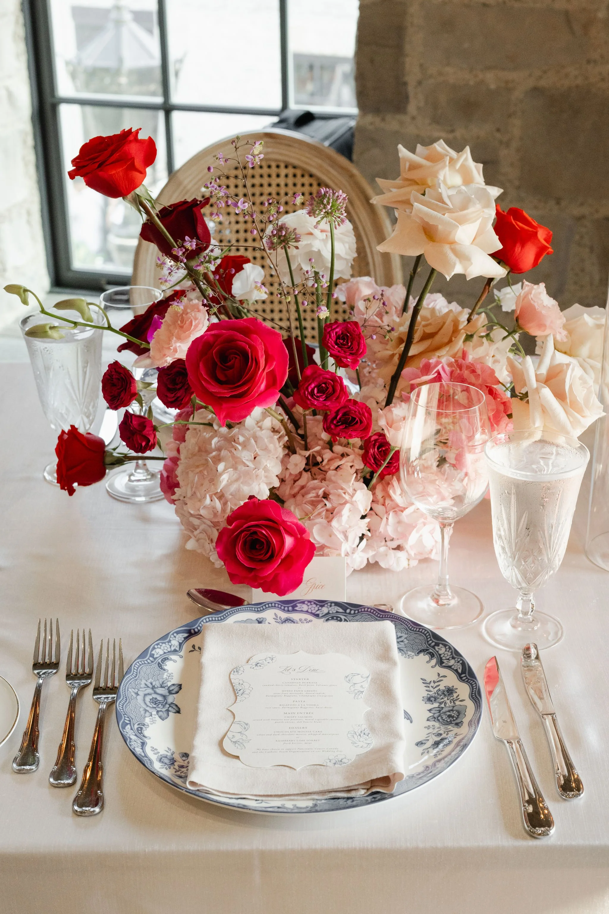 Toile Charger Plate with Hot pink and red florals at Elora Mill.