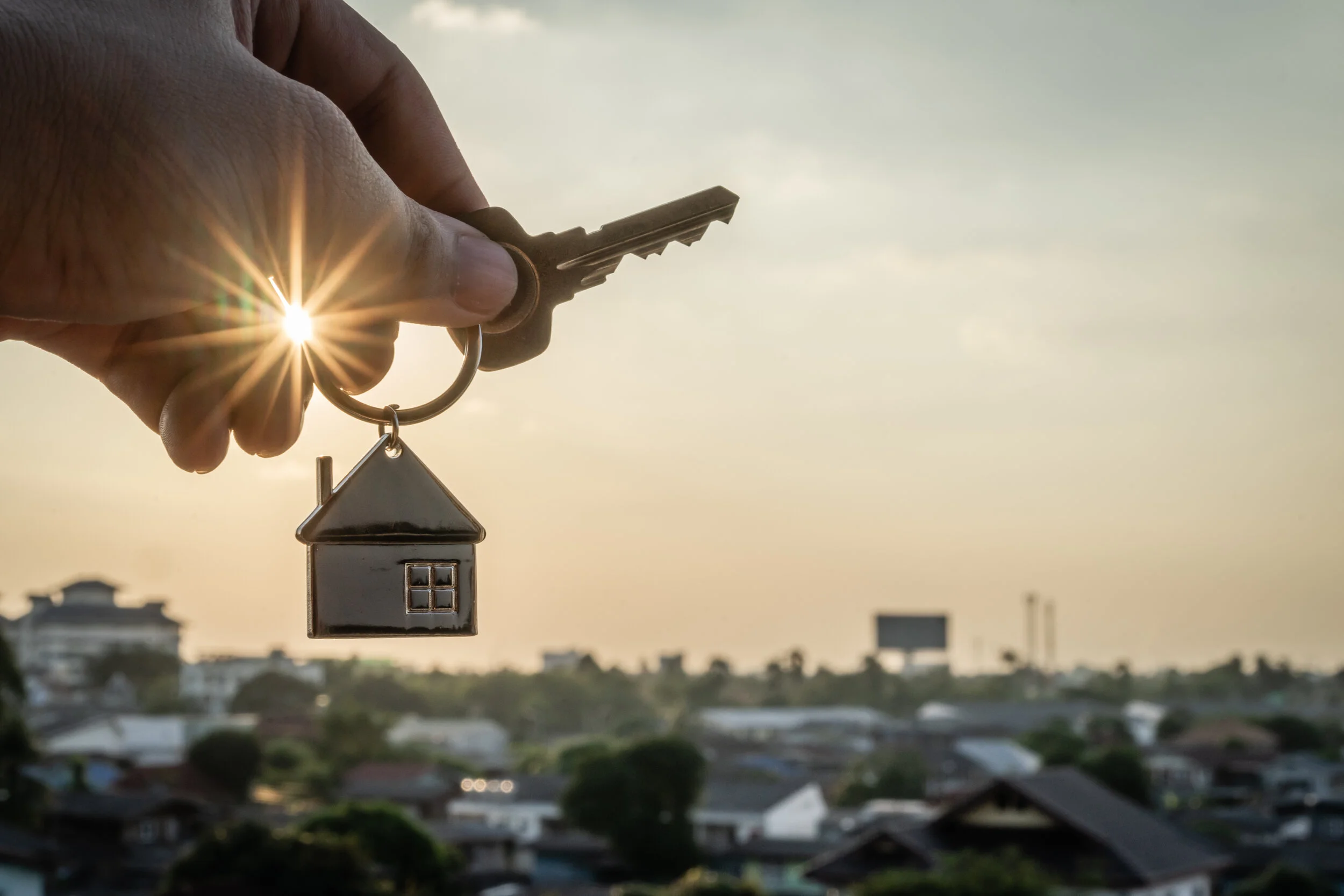 House-model-and-key-in-home-insurance-broker-agent--hand-or-in-salesman-person.-Real-estate-agent-offer-house,-property-insurance-and-security,-affordable-housing-concepts-1076671622_5732x3821.jpeg