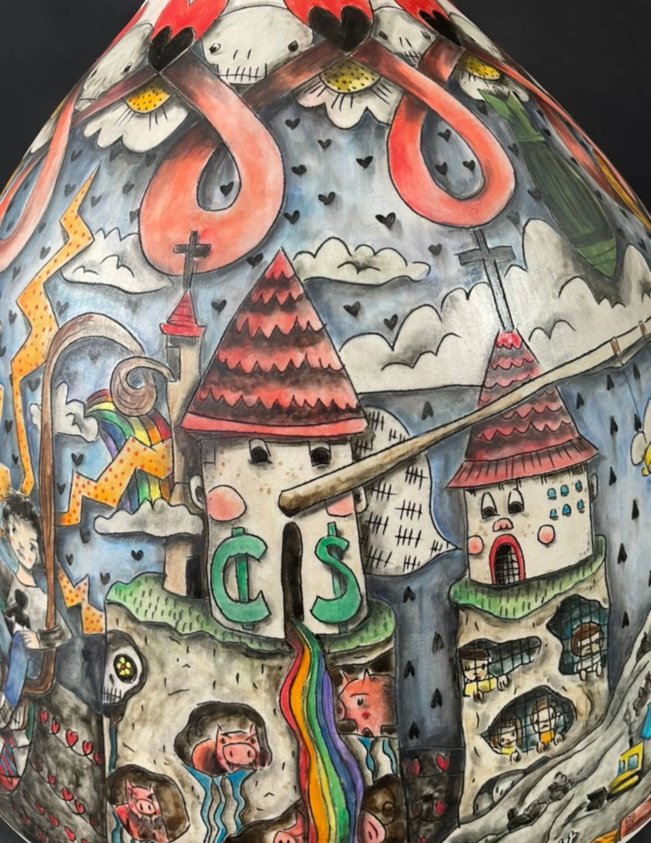 Colorful illustration on a spherical surface featuring cartoonish haunted houses with red roofs, pink faces, and expressive eyes, surrounded by rainbows, clouds, lightning, and various whimsical characters and symbols.