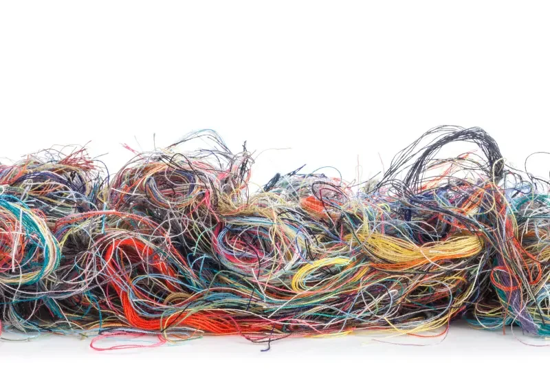 Multiple colored threads tangled together