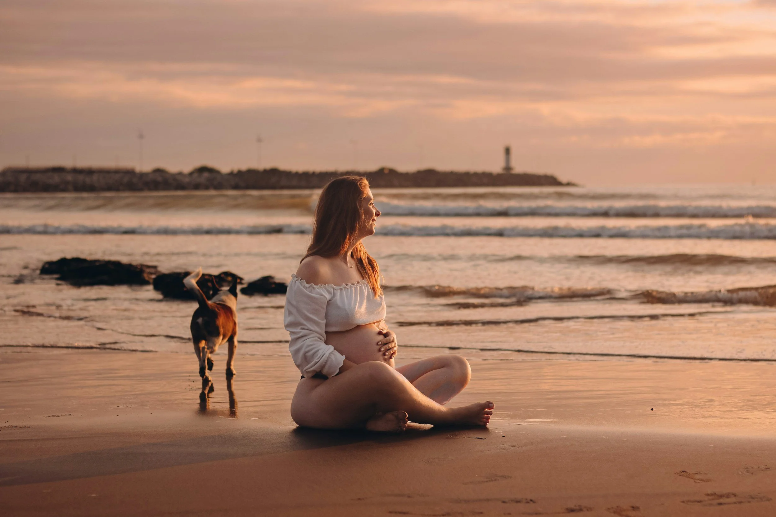 A mother holding her baby while managing the invisible mental load, highlighting postpartum anxiety support and trauma-informed care across Aurora and Vaughan.