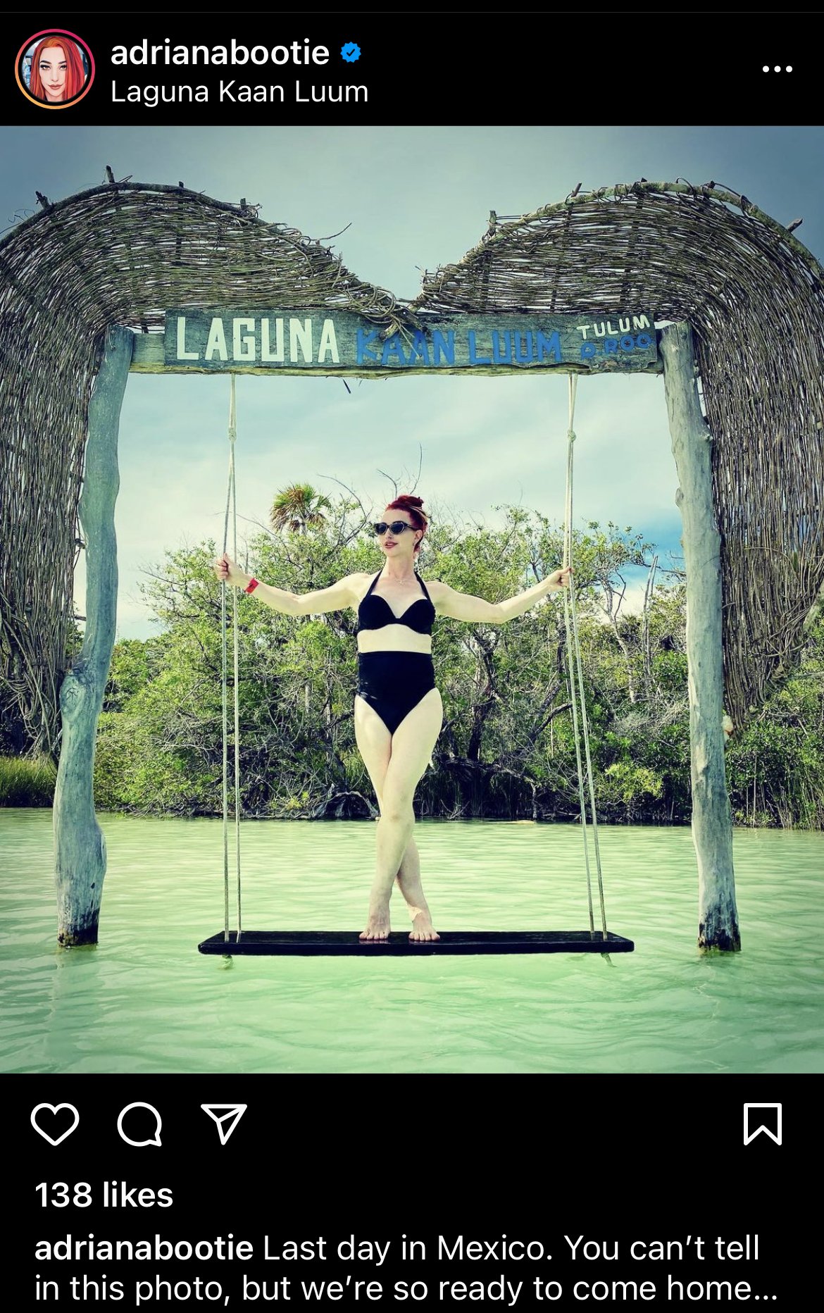 Adriana Bootie in Laguna Kaan Luum, Mexico on a swing over water wearing a black bikini