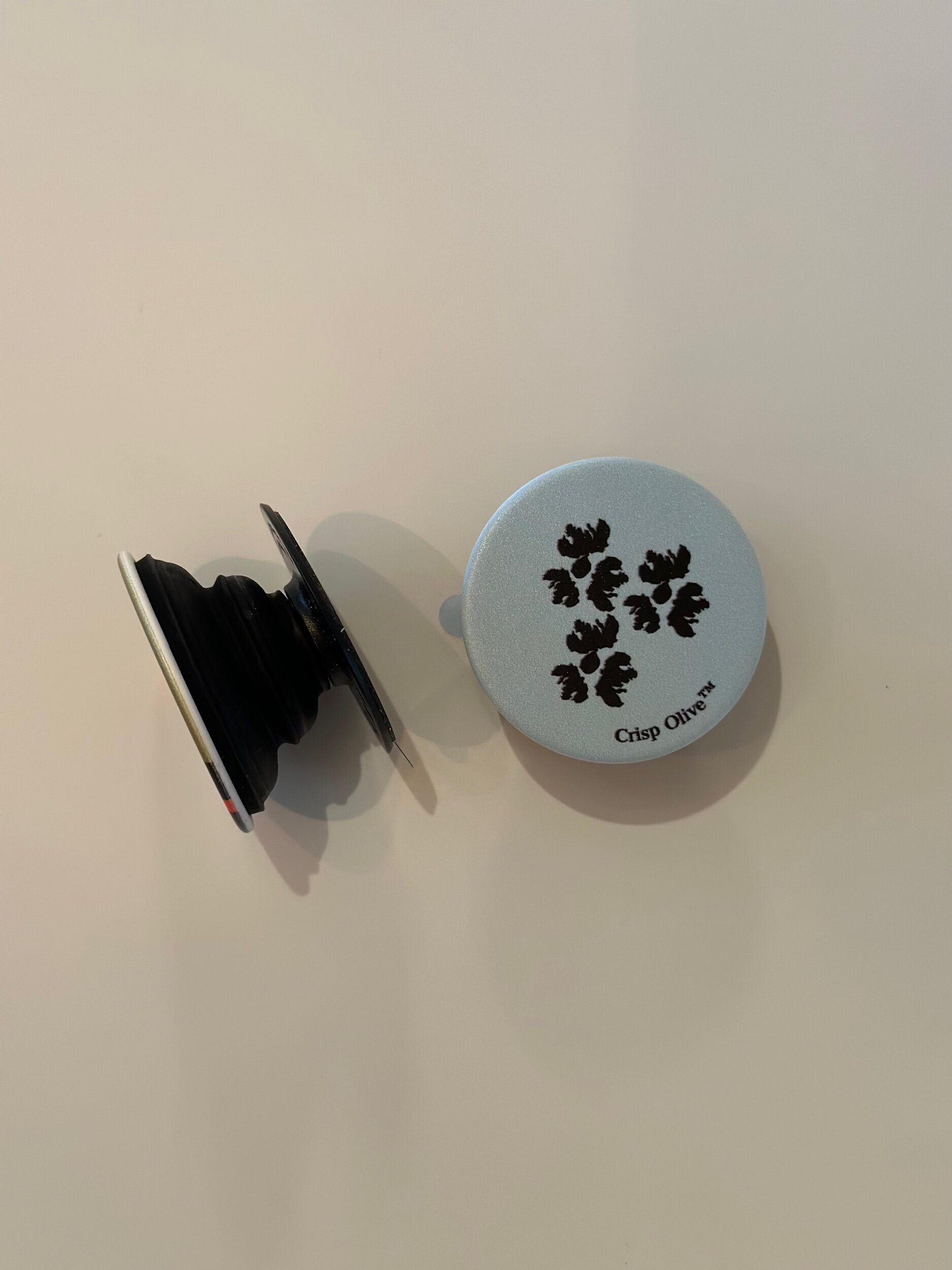 Phone protection with style with Crisp Olive's custom-designed 'Pop Sockets' phone grips. Lightweight, made in U.S.A, a unique gift or a fashionable phone accessory.