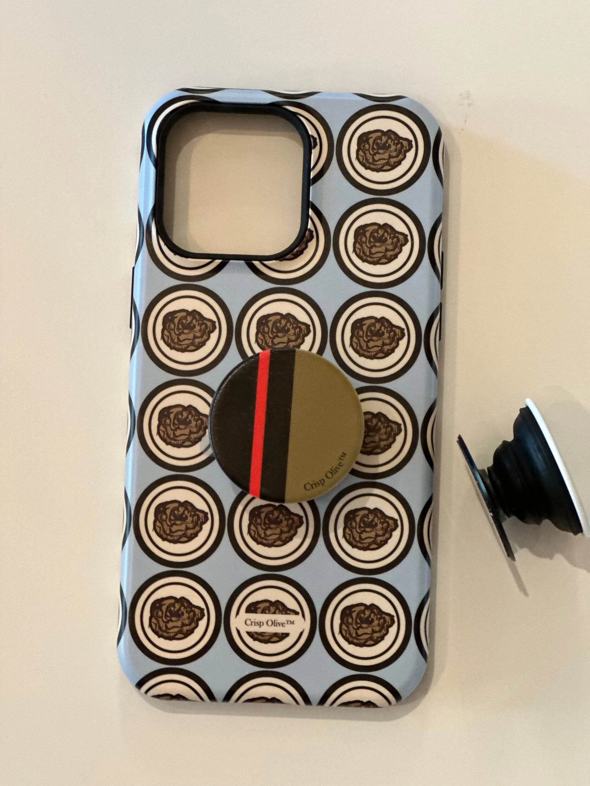 Phone protection with style with Crisp Olive's custom-designed 'Pop Sockets' phone grips. Lightweight, made in U.S.A, a unique gift or a fashionable phone accessory.