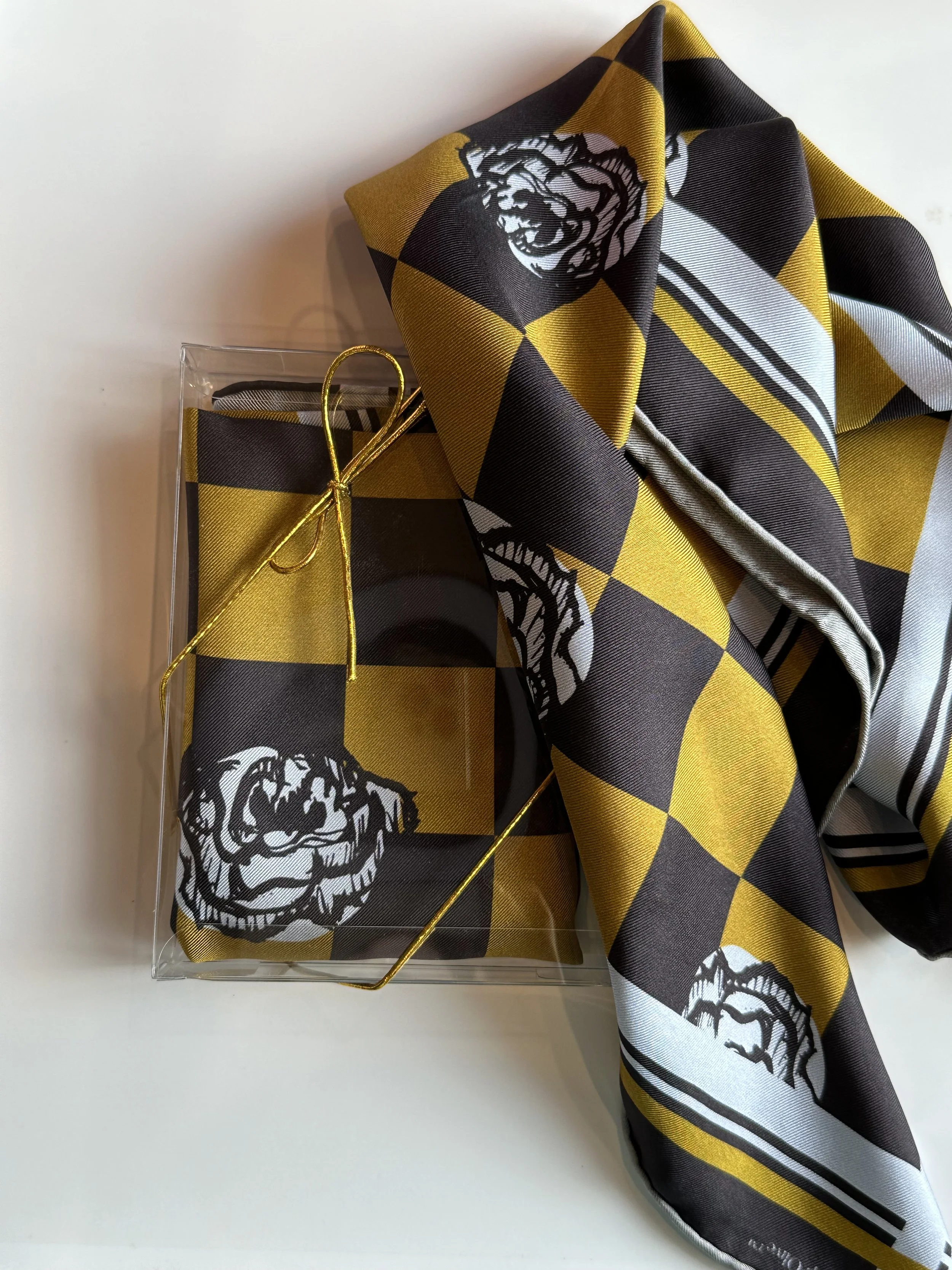 A gorgeously patterned 100% silk scarf, designed by Crisp Olive™ Studio. A checkered background of olive and black and light blue roses. A fashion statement to style up outfits instantly.