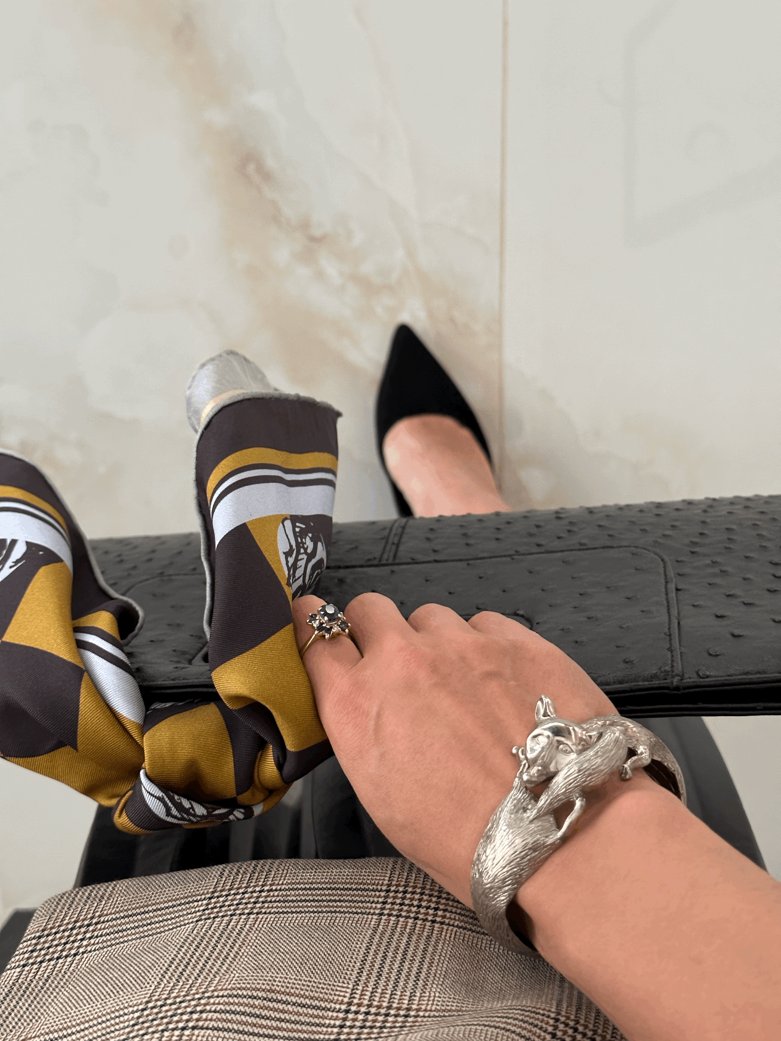 A gorgeously patterned 100% silk scarf, designed by Crisp Olive™ Studio. A checkered background of olive and black and light blue roses. A fashion statement to style up outfits instantly.