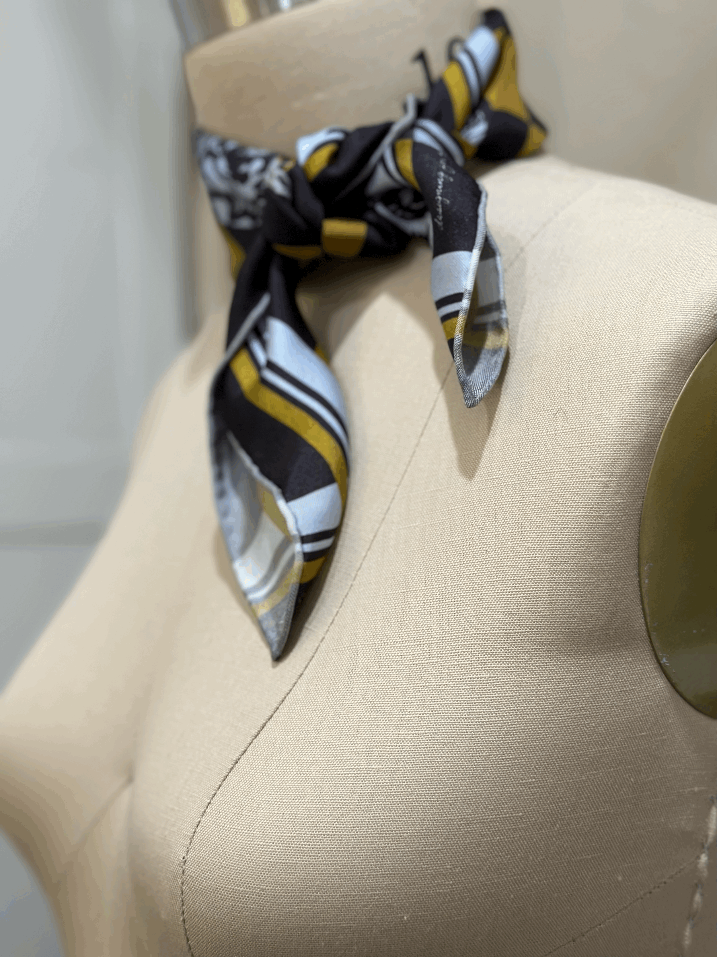 A gorgeously patterned 100% silk scarf, designed by Crisp Olive™ Studio. A checkered background of olive and black and light blue roses. A fashion statement to style up outfits instantly.