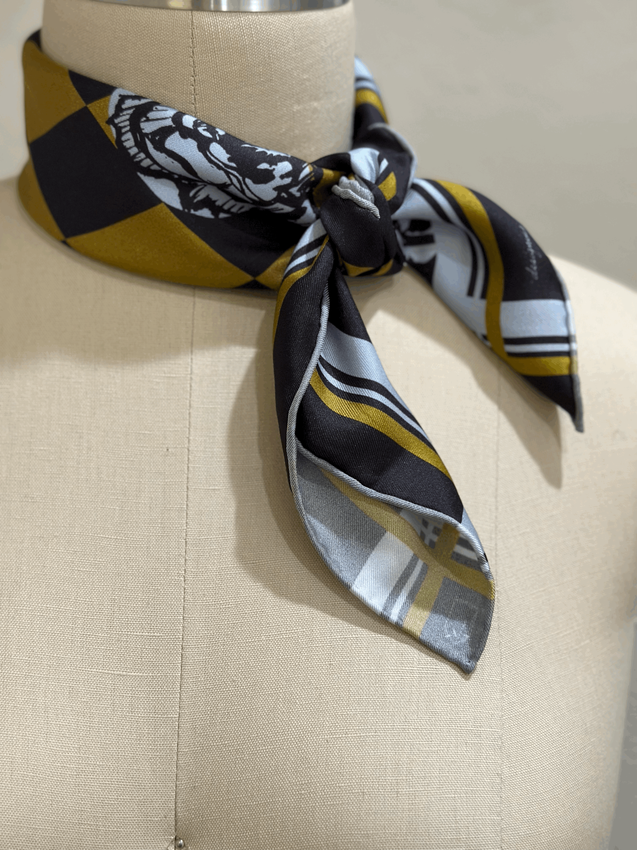 A gorgeously patterned 100% silk scarf, designed by Crisp Olive™ Studio. A checkered background of olive and black and light blue roses. A fashion statement to style up outfits instantly.