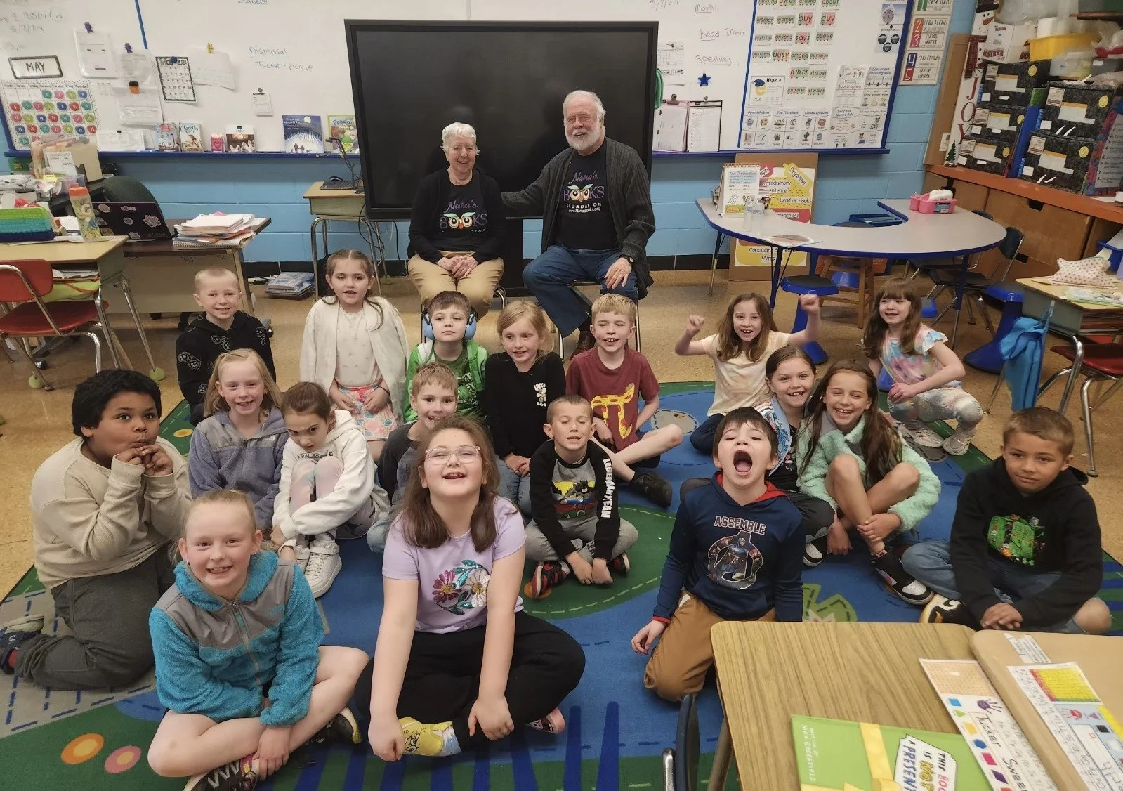 Jayne and Dan Cahill with students in a William L. Callahan Elementary School classroom in Burrillville, Rhode Island, during the Nana’s Books Foundation visit.