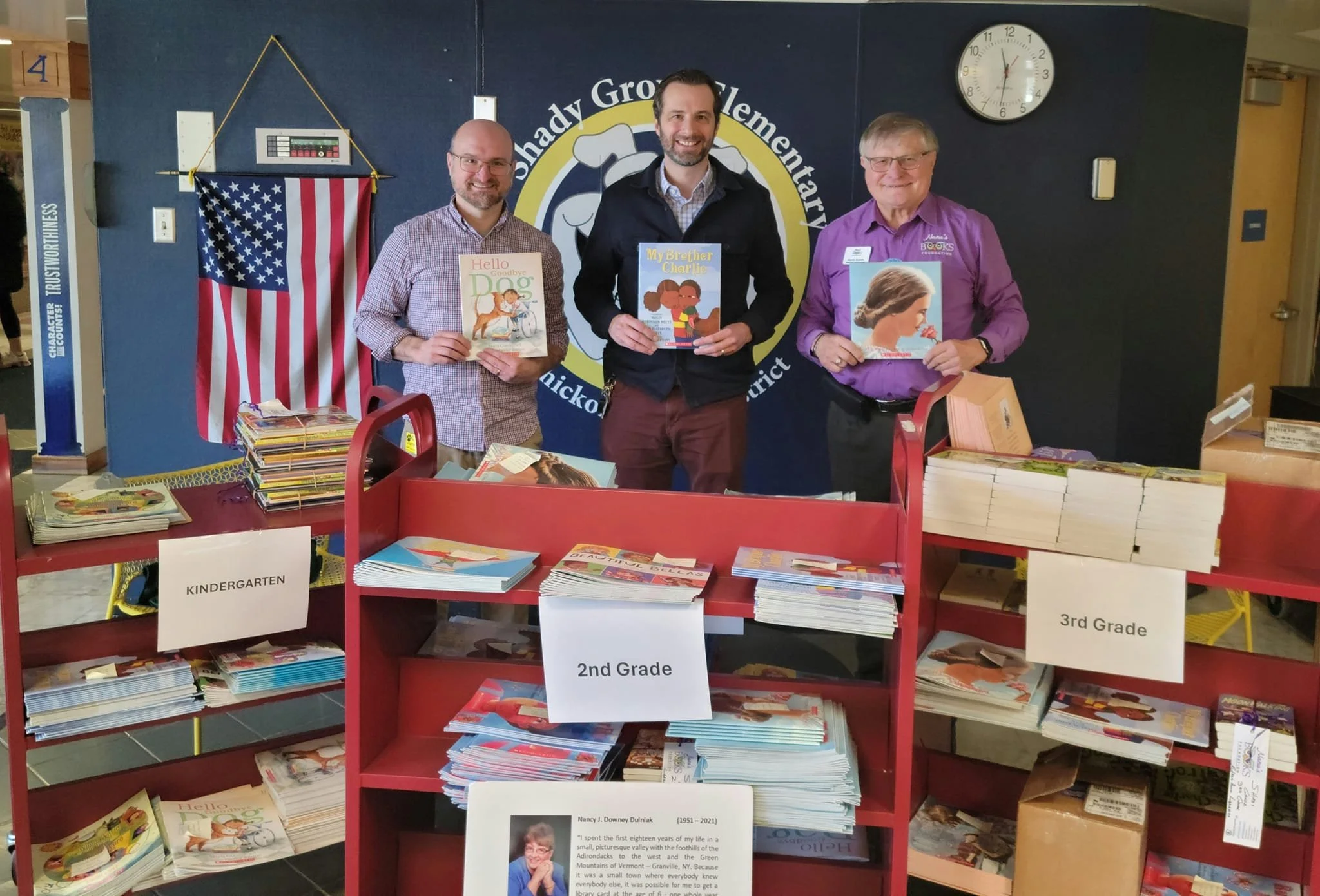 Craig Dulniak, Shady Grove Elementary Principal Dr. Jason Bialko, and Nana’s Books Foundation President Dennis Dulniak with books organized for distribution at the Ambler, Pennsylvania school.