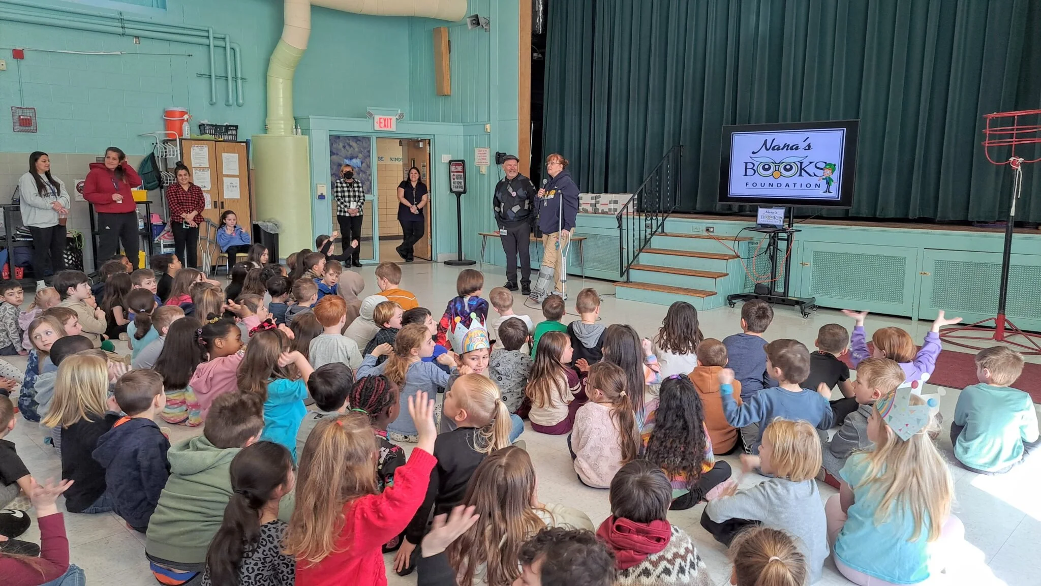 Students gather during a Nana’s Books Foundation visit to William L. Callahan Elementary School in Burrillville, Rhode Island.