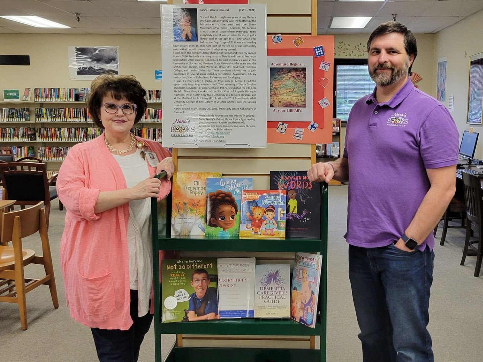 Nana’s Books Foundation book display at Knox County Public Library with librarian Leslie Cutshaw and Mark Dulniak.