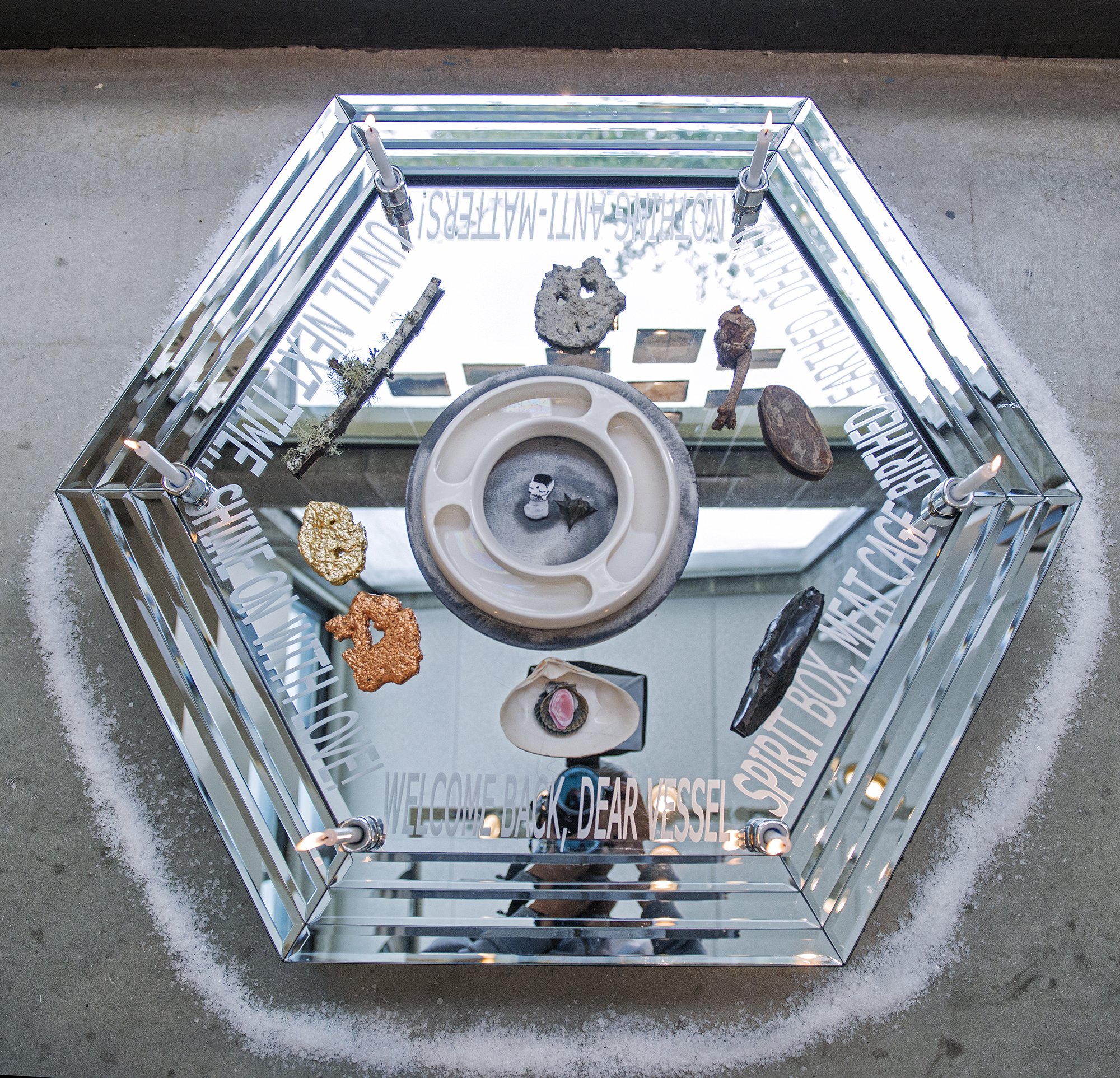 Hexagoner (She’s Mantic)
Glass mirror, salt, candles, stone, metal leaf, wood, shell, salt, watercolor, paper, water, Ghost Pipe tincuture, vinyl decal,
2026
34 x 36 x 6 inches
Incantation: Welcome Back, Dear Vessel/Spirit Box, Meat Cage/Birth'd, Ear