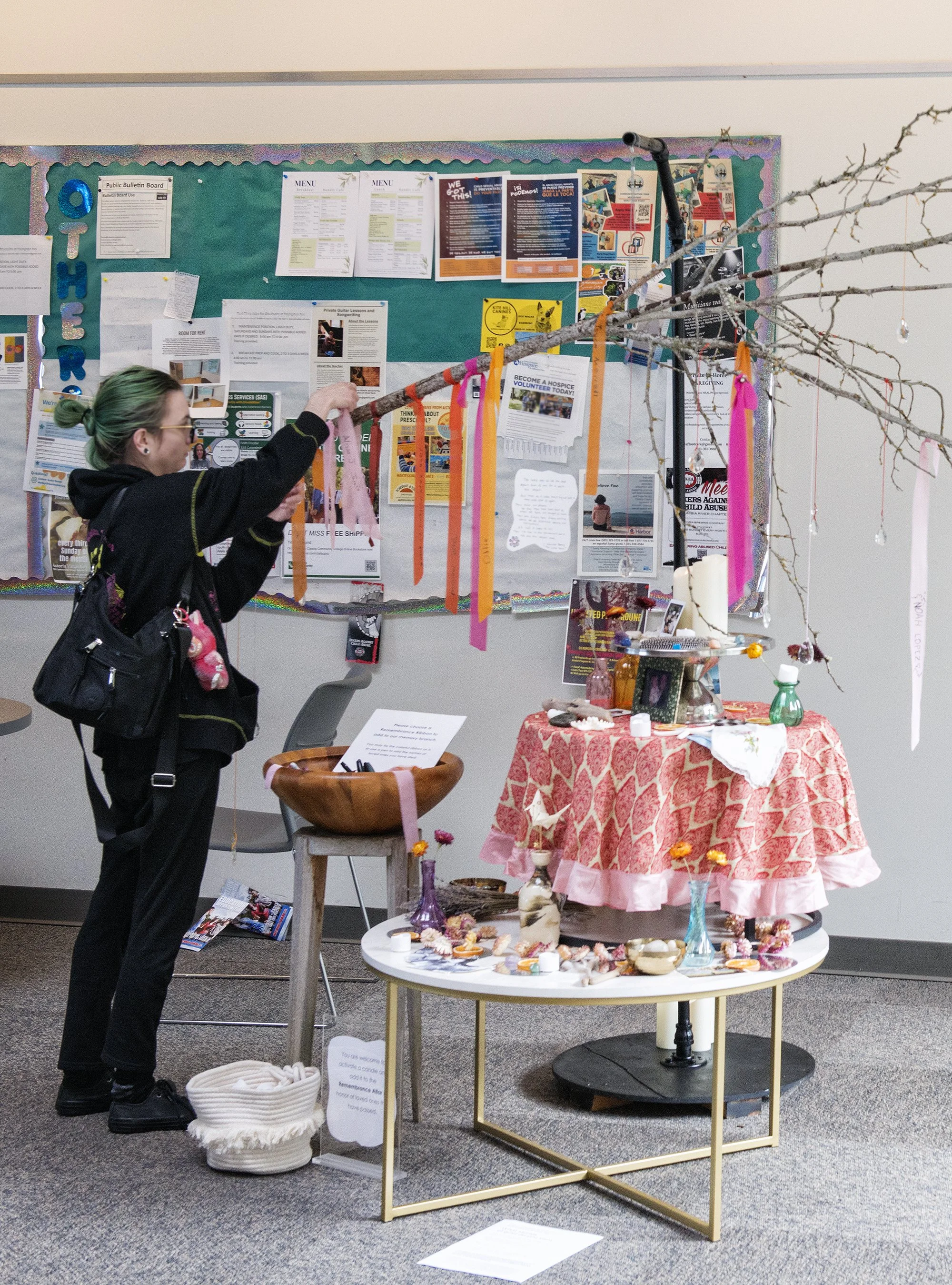 'Remembrance Altar' by Colesie Tharp, Columbia Hall, Clatsop Community College. Colesie creates symbolic 'Remembrance Altar' using beautiful recycled materials for the public to add to and rework throughout the exhibition. Participants are invited to