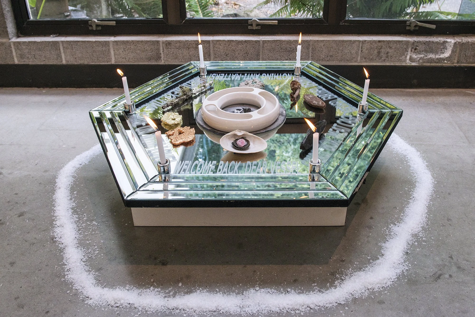 Hexagoner (She’s Mantic)
Glass mirror, salt, candles, stone, metal leaf, wood, shell, salt, watercolor, paper, water, Ghost Pipe tincuture, vinyl decal
2026
34 x 36 x 6 inches