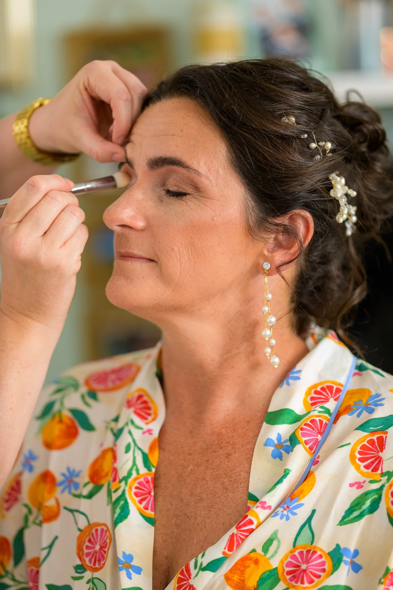 The bride getting her makeup down pre-wedding