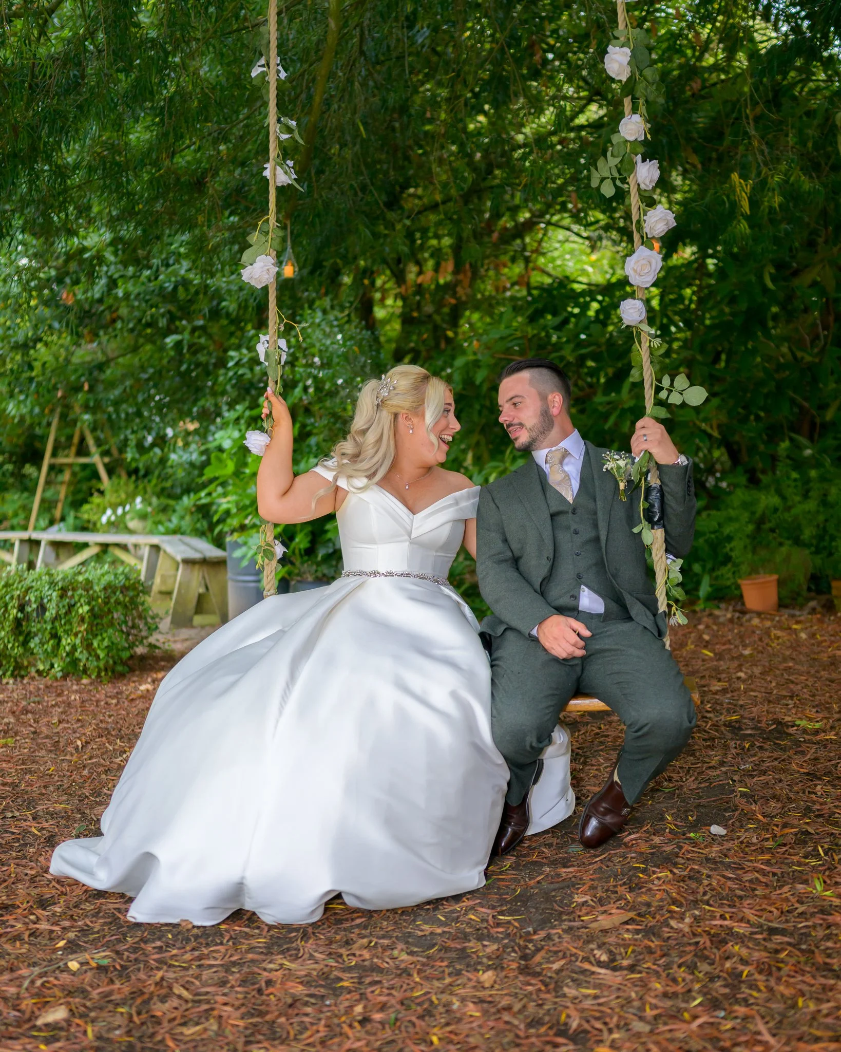 Dorset wedding photographer The Old Vicarage bride and groom on a swing