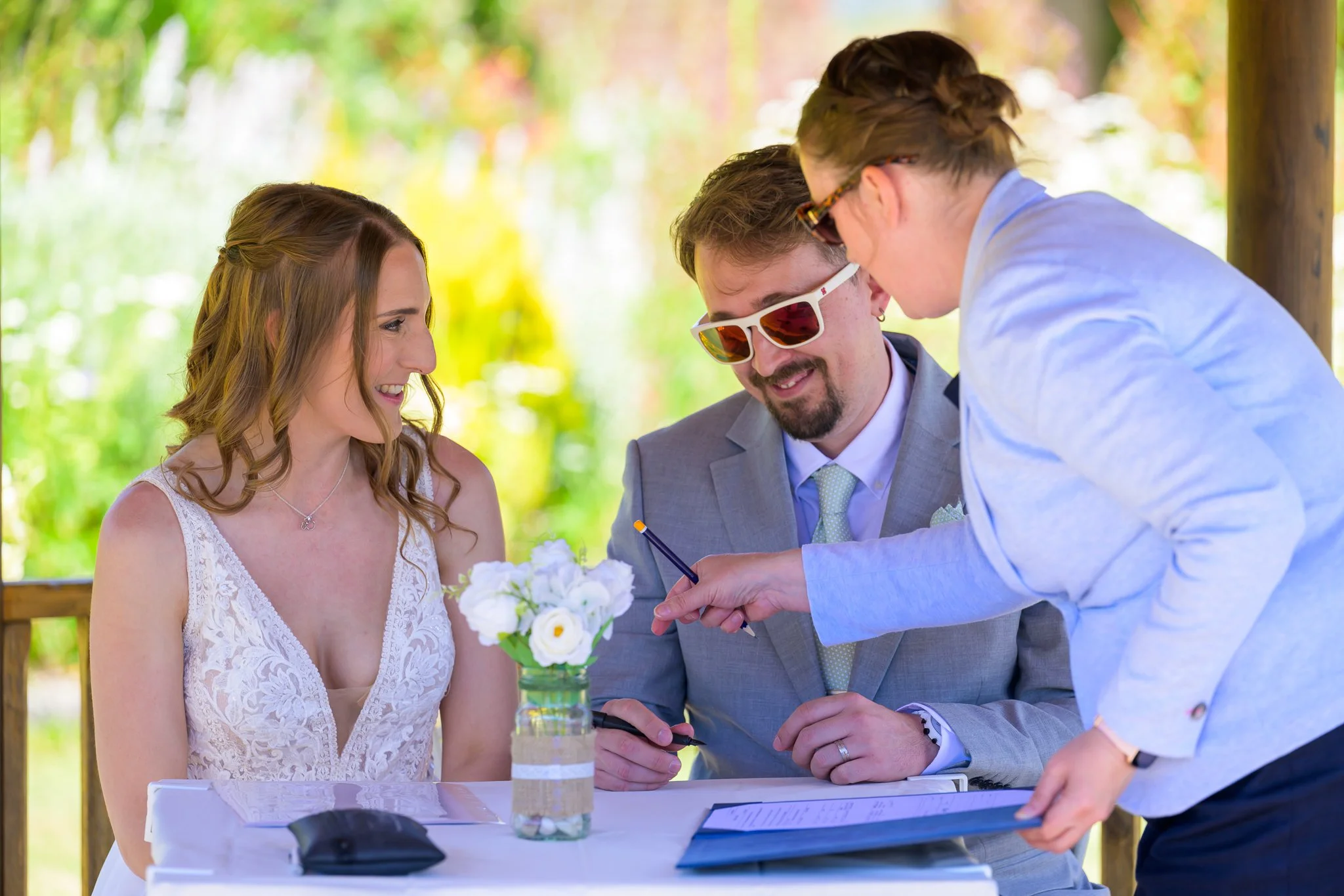 A bride and groom writing and confirming their wedding vows