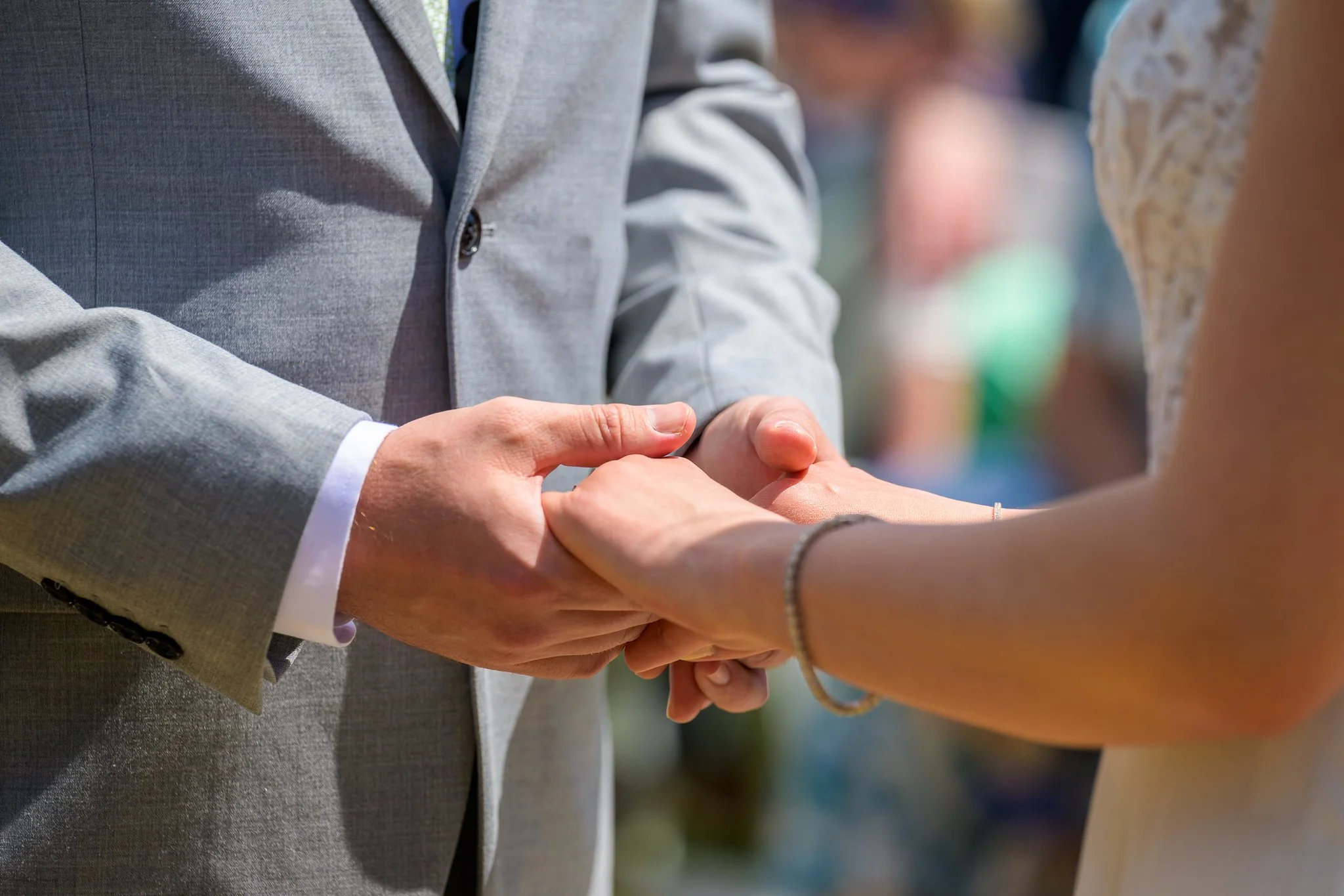 A bride and groom holding hands