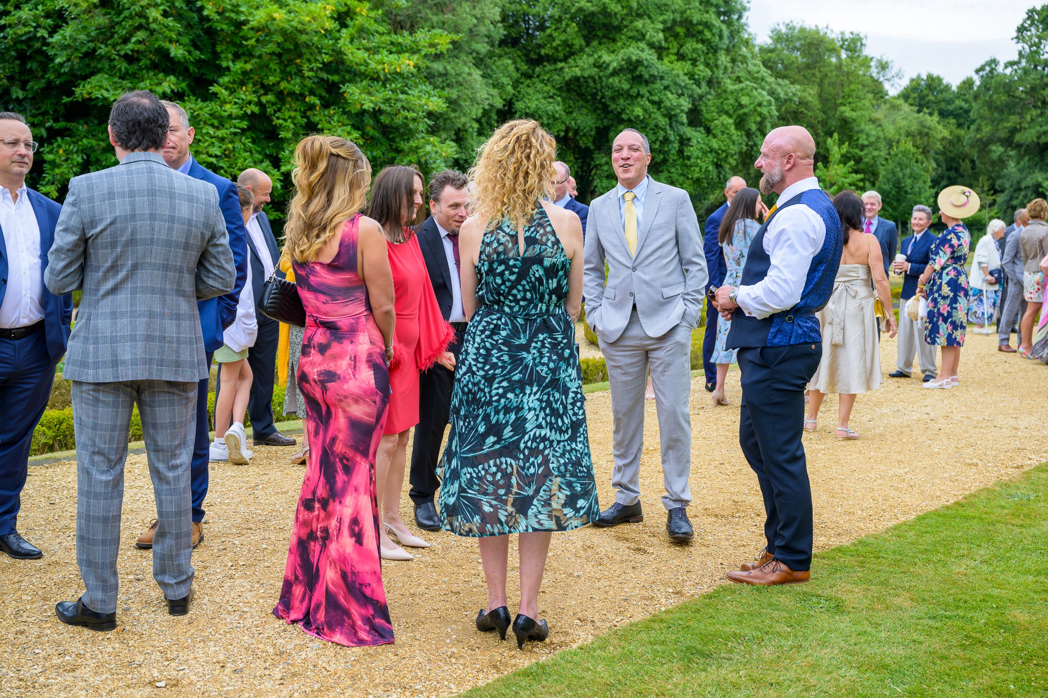 Wedding guests stood around and having fun outside the wedding venue