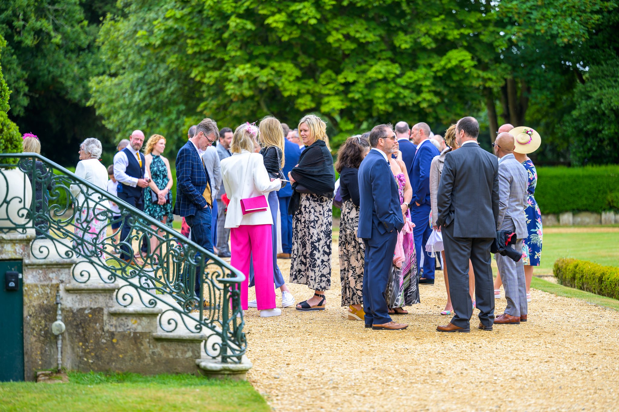 Wedding guests stood around outside the wedding venue