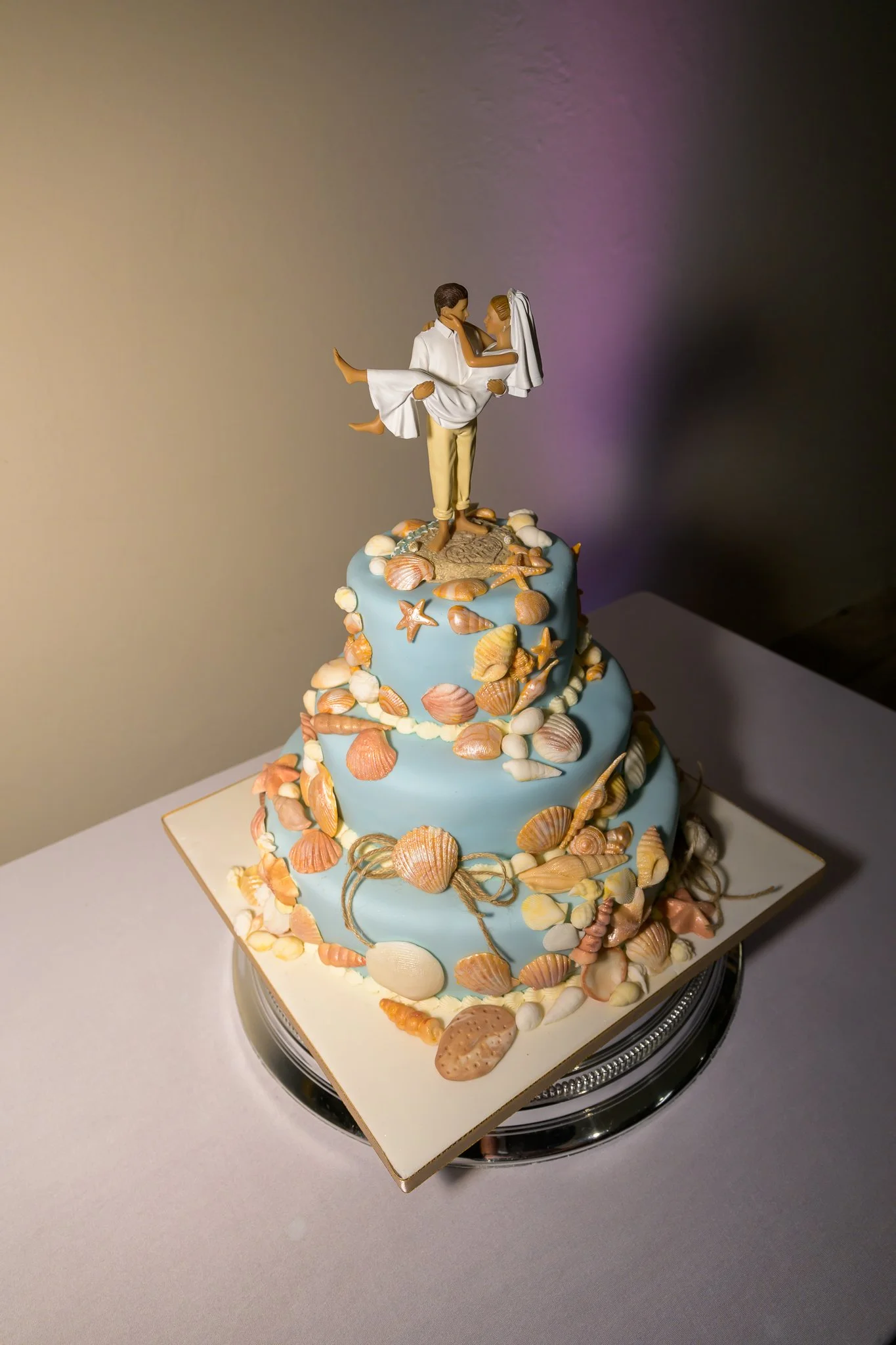 A colourful wedding cake sat on a table