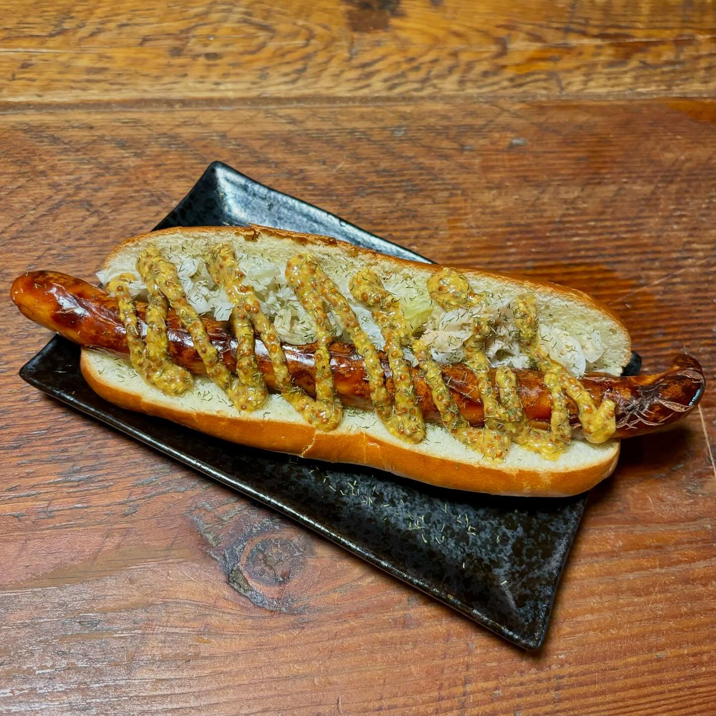 Introducing the North Sea P&oslash;lse! Pork frankfurter on a grilled brioche bun with aquavit sauerkraut &amp; whole grain mustard. $13 with option to add a side for $4