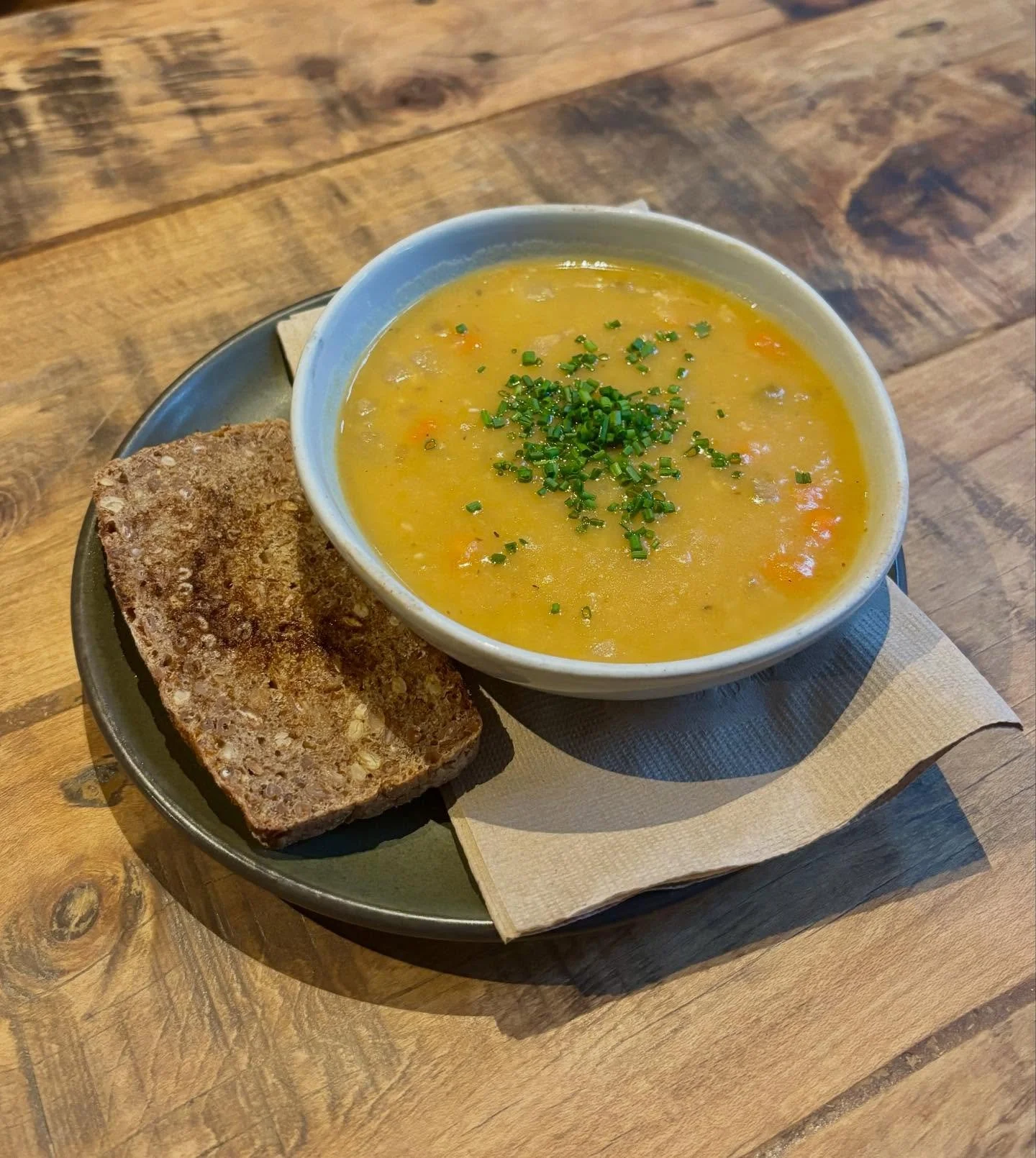We have the perfect rainy day menu launch! Our Norwegian Yellow Split Pea Soup is made with an assortment of root veggies braised in a savory veggie broth, served with toasted rye. Available as a cup or bowl. It’s vegetarian, unless you want to