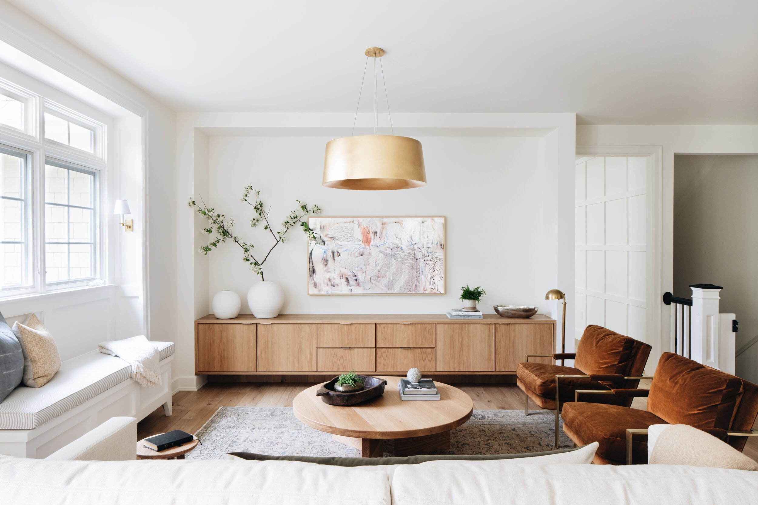 light wood console with brass hardware