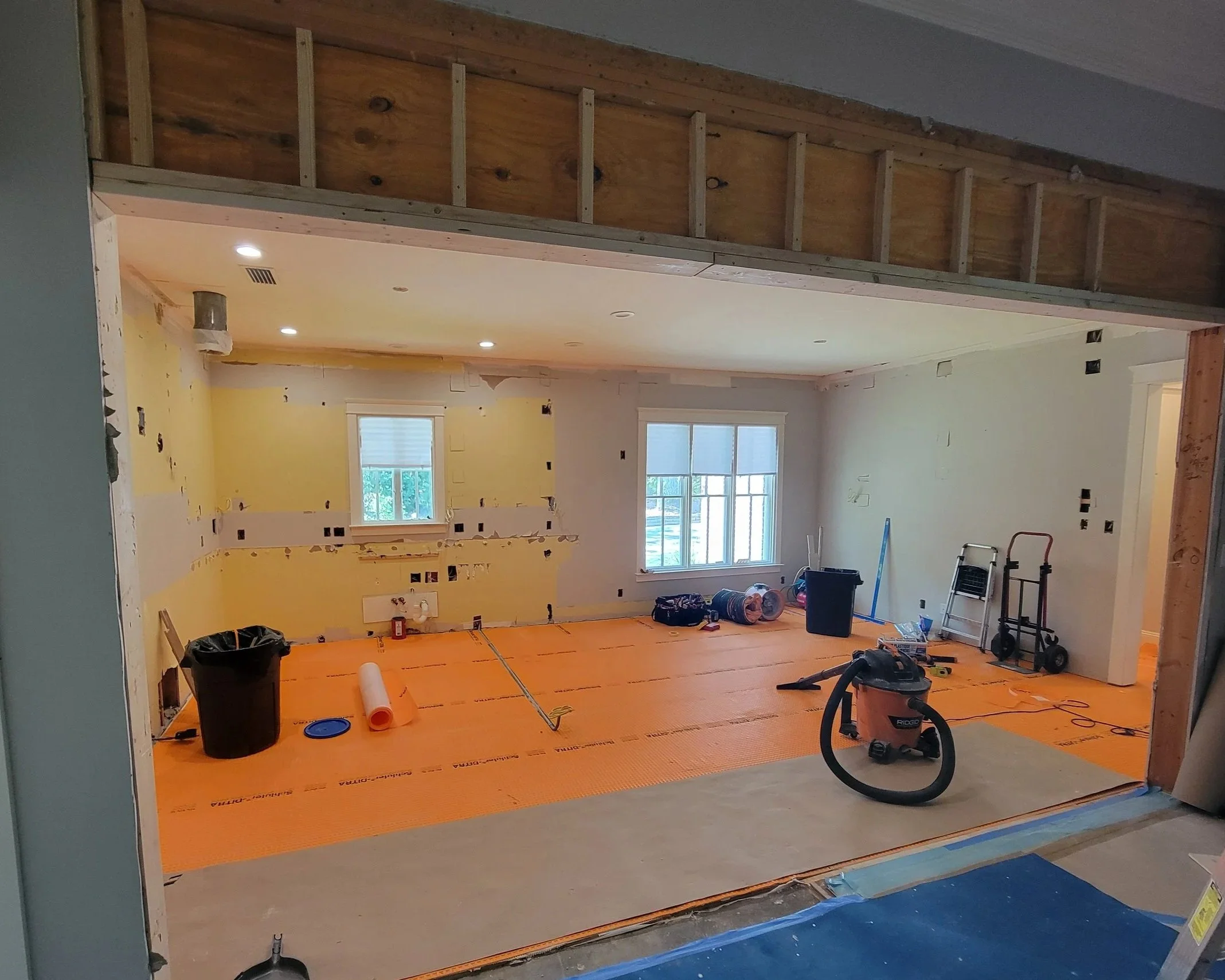 The wall opened and new beam installed.