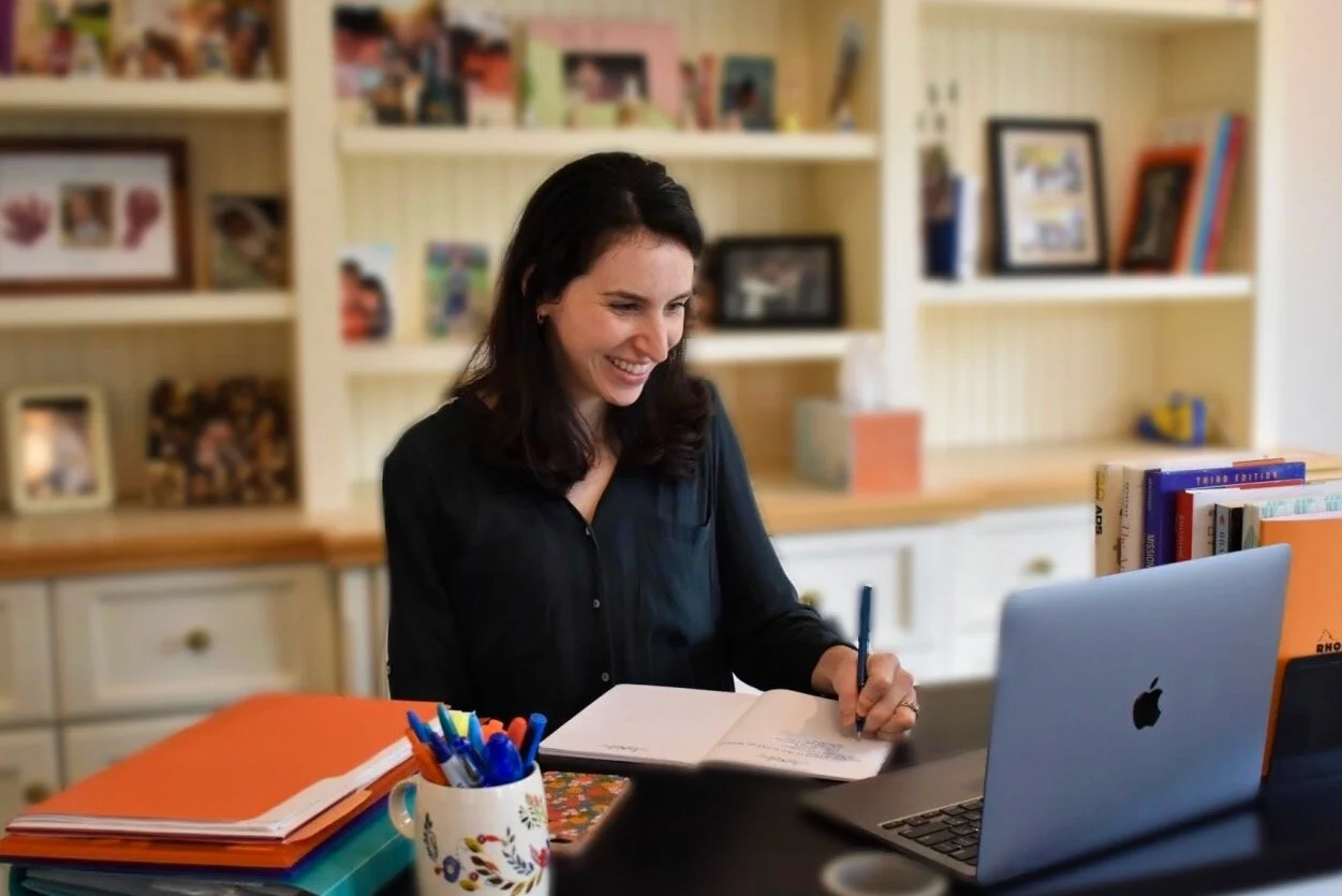 Jordana Sitting at Desk on Zoom with Nonprofit Client