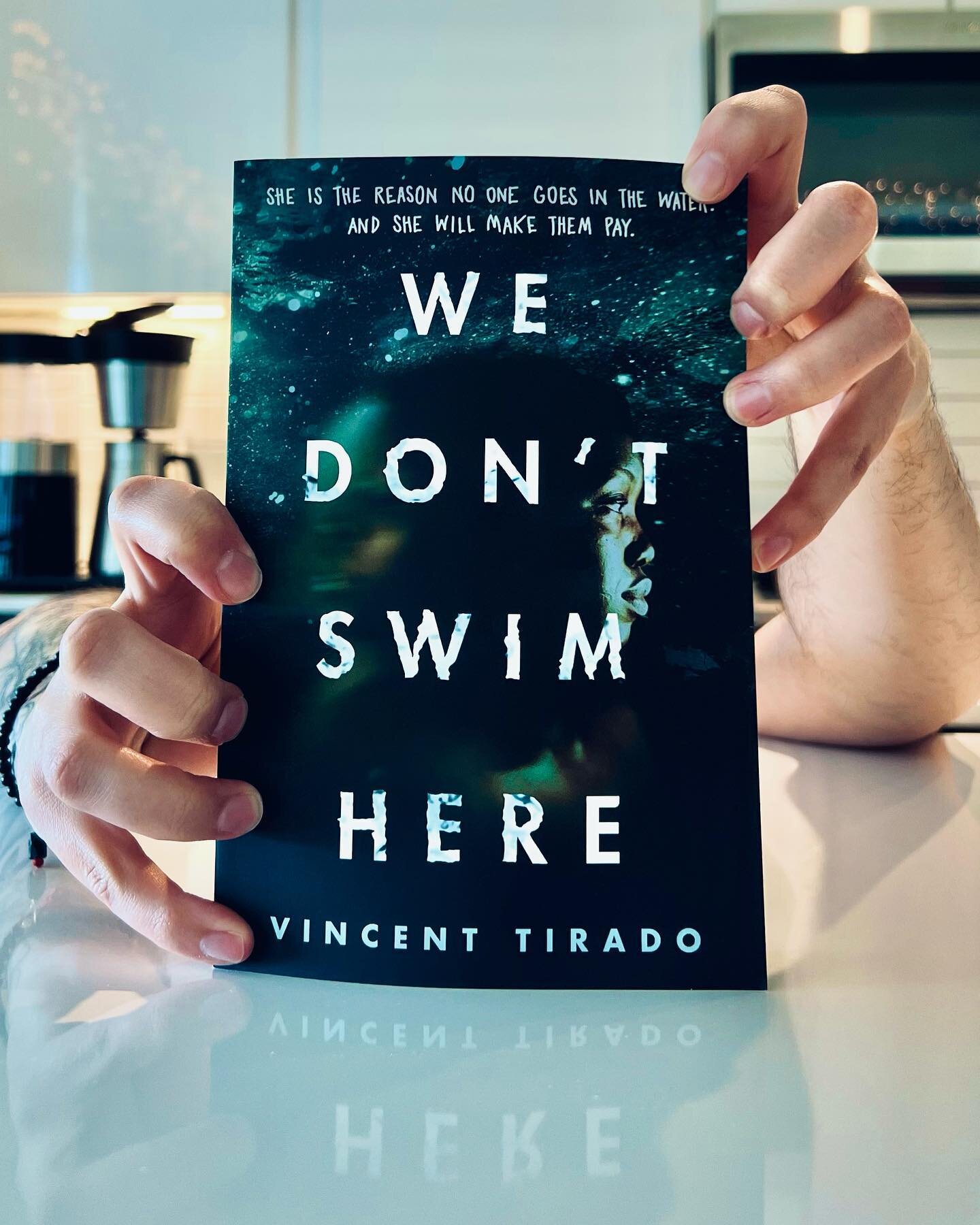 happy pub week to @v_e_tirado and WE DONT SWIM HERE!

can&rsquo;t wait to dive into this dark and chilling story, just in time for pool season 👀

(i polished the shit out of my counter to get that reflection effect lmao SOMEONE MAKE ME AN INFLUENCER