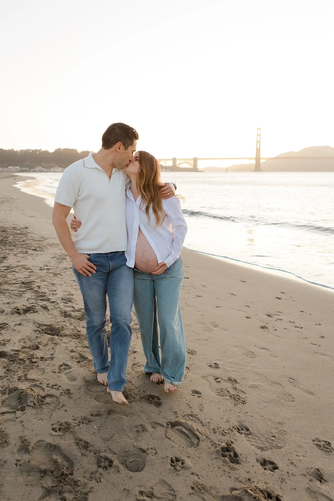 san francisco maternity photos on the beach with the golden gate bridge