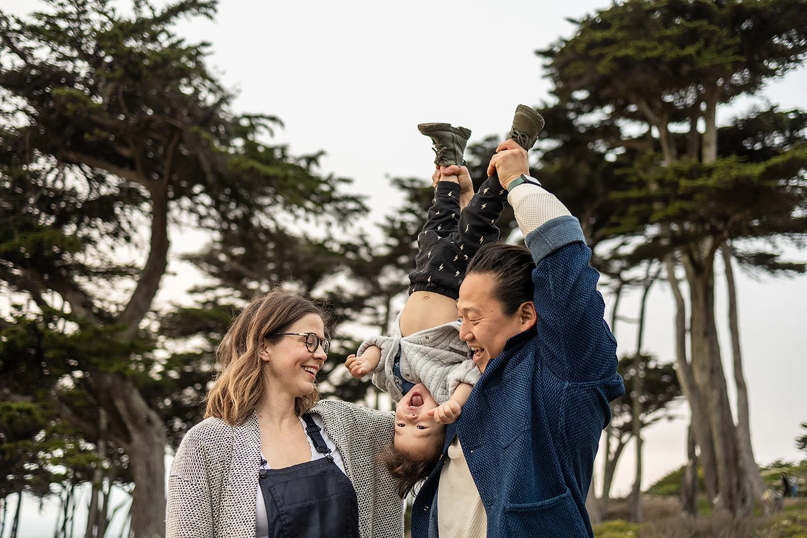 Playful family with toddler at lands end mini session in san francisco.