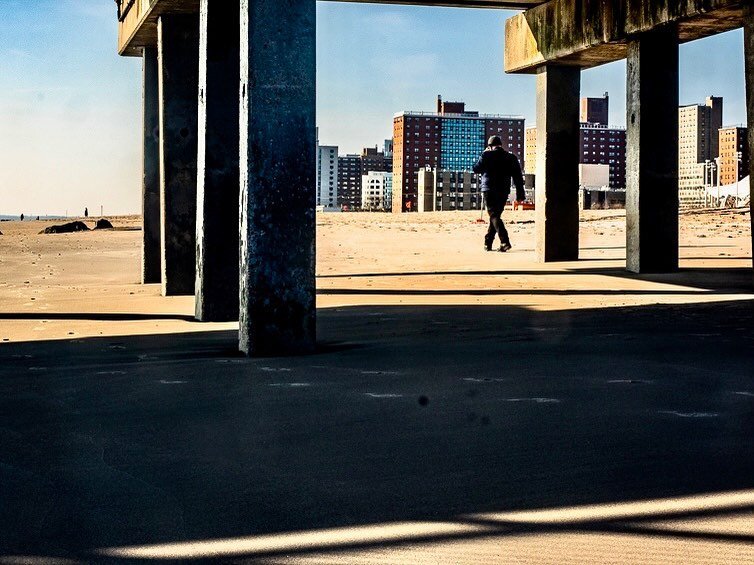 Walking along Coney Island Beach near the Pat Auletta Steeplechase Pier.