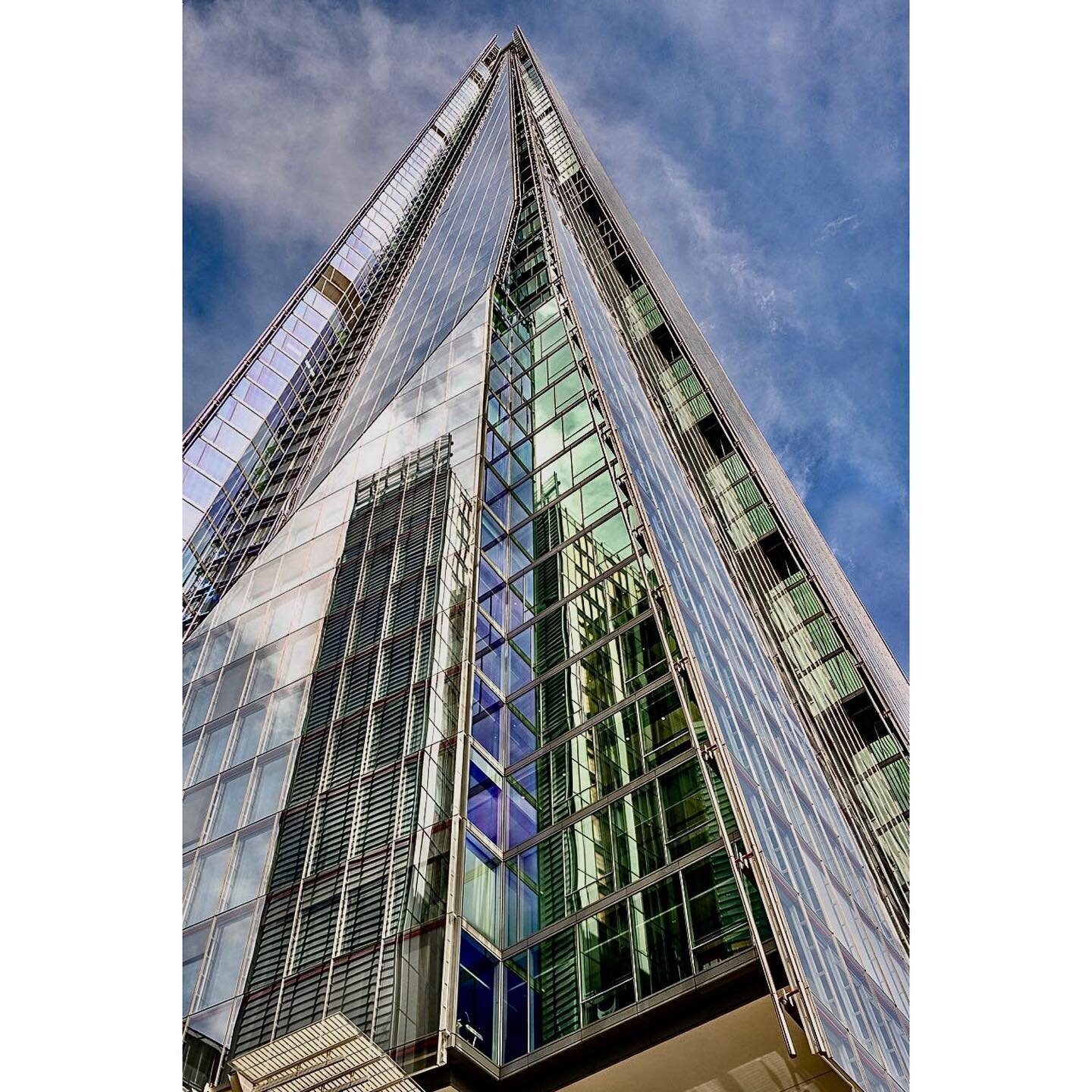Reflections on The Shard,  a 72-storey skyscraper in Southwark, London designed by architect Renzo Piano as a spire-like sculpture emerging from the Thames.