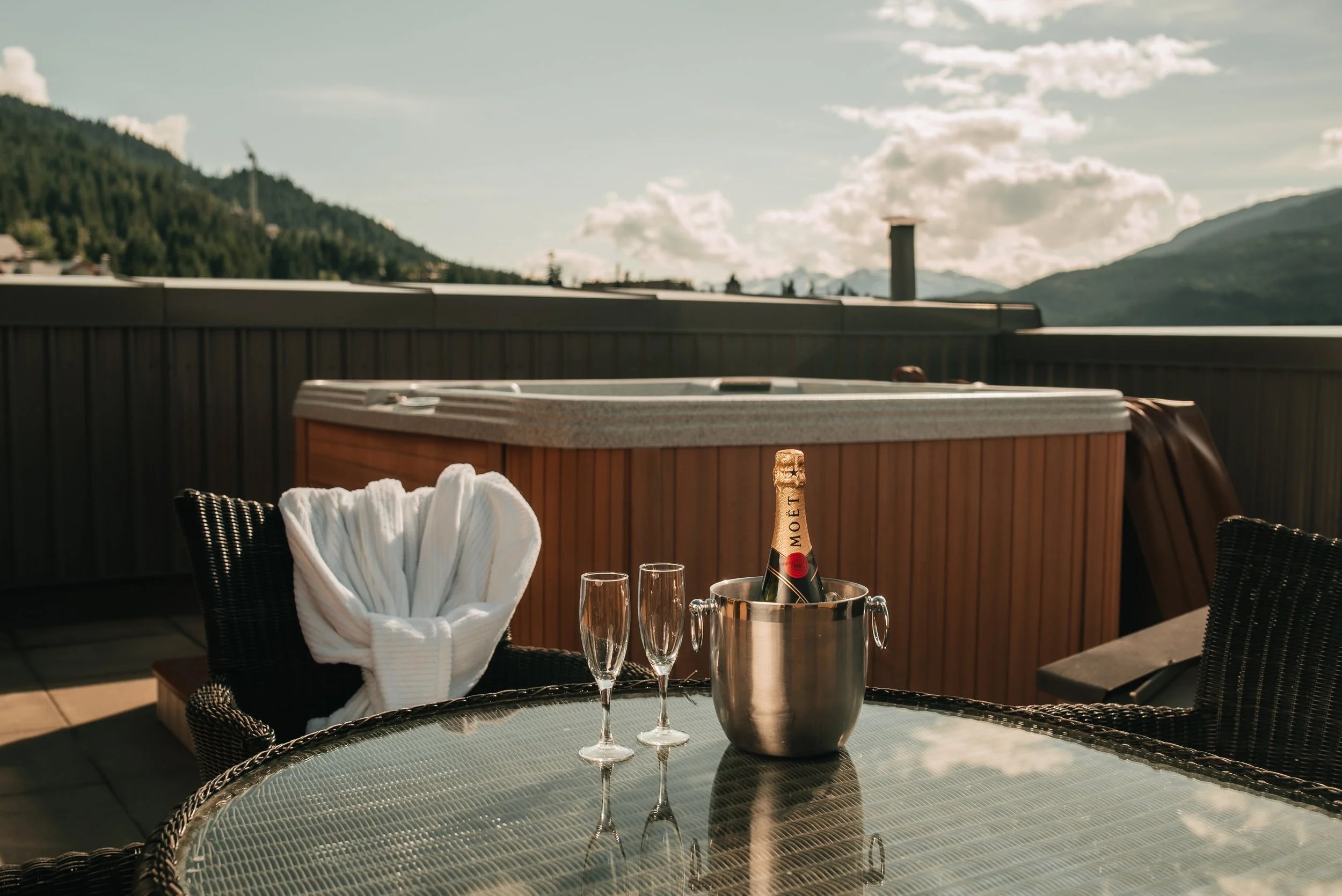 Image of private hot tub with champaign bottle and glass.