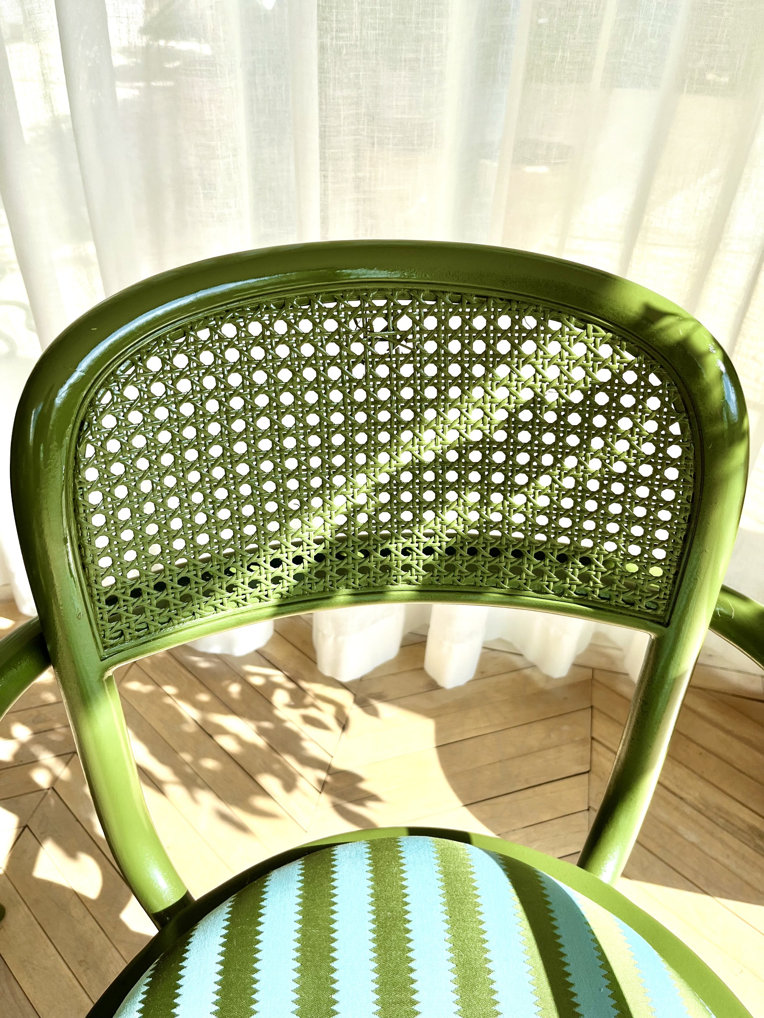 Set of six green lacquered and upholstered bentwood and cane bistro chiars 11.jpeg