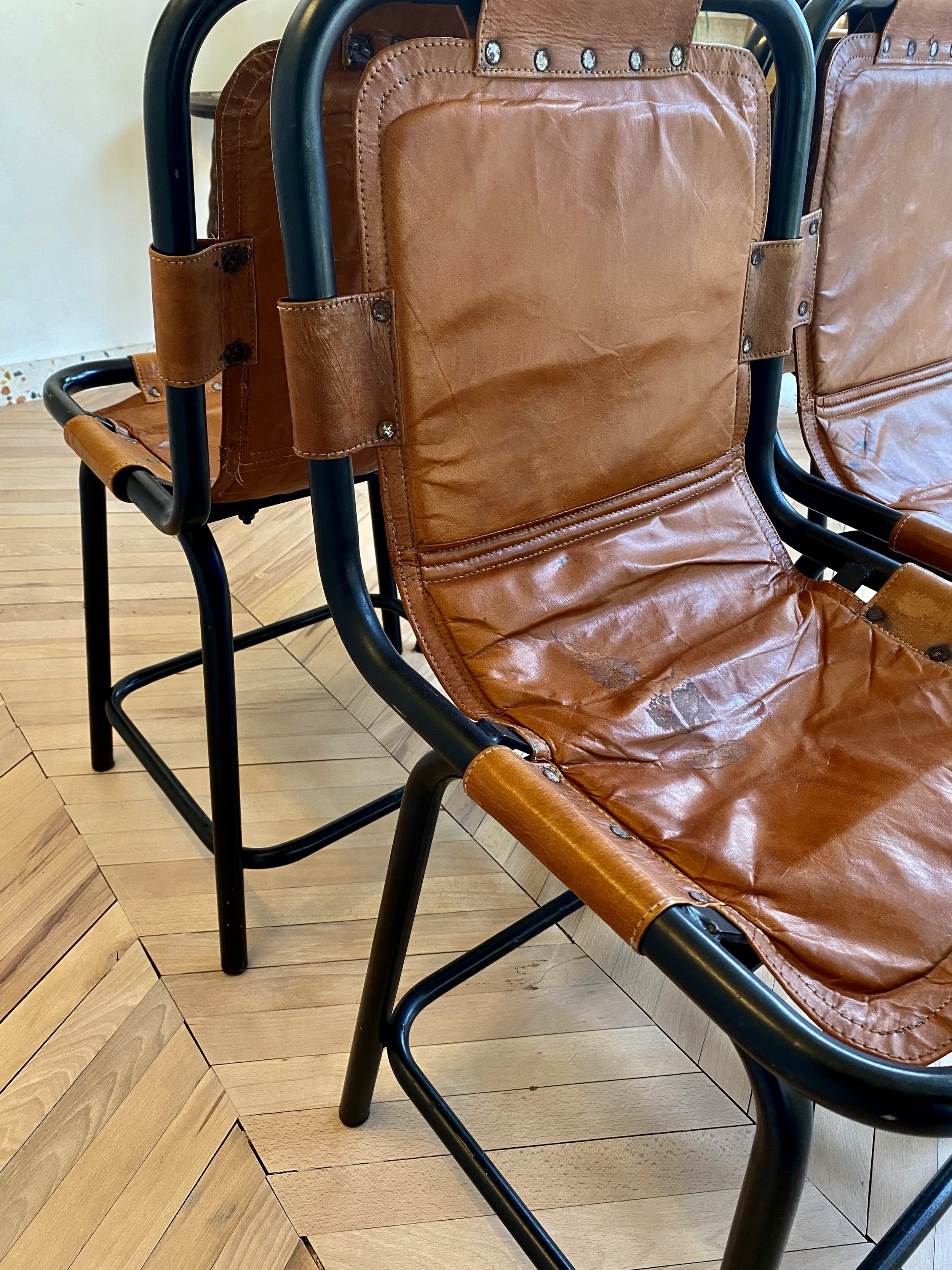 set of four metal and leather les arcs style chairs 25.jpeg