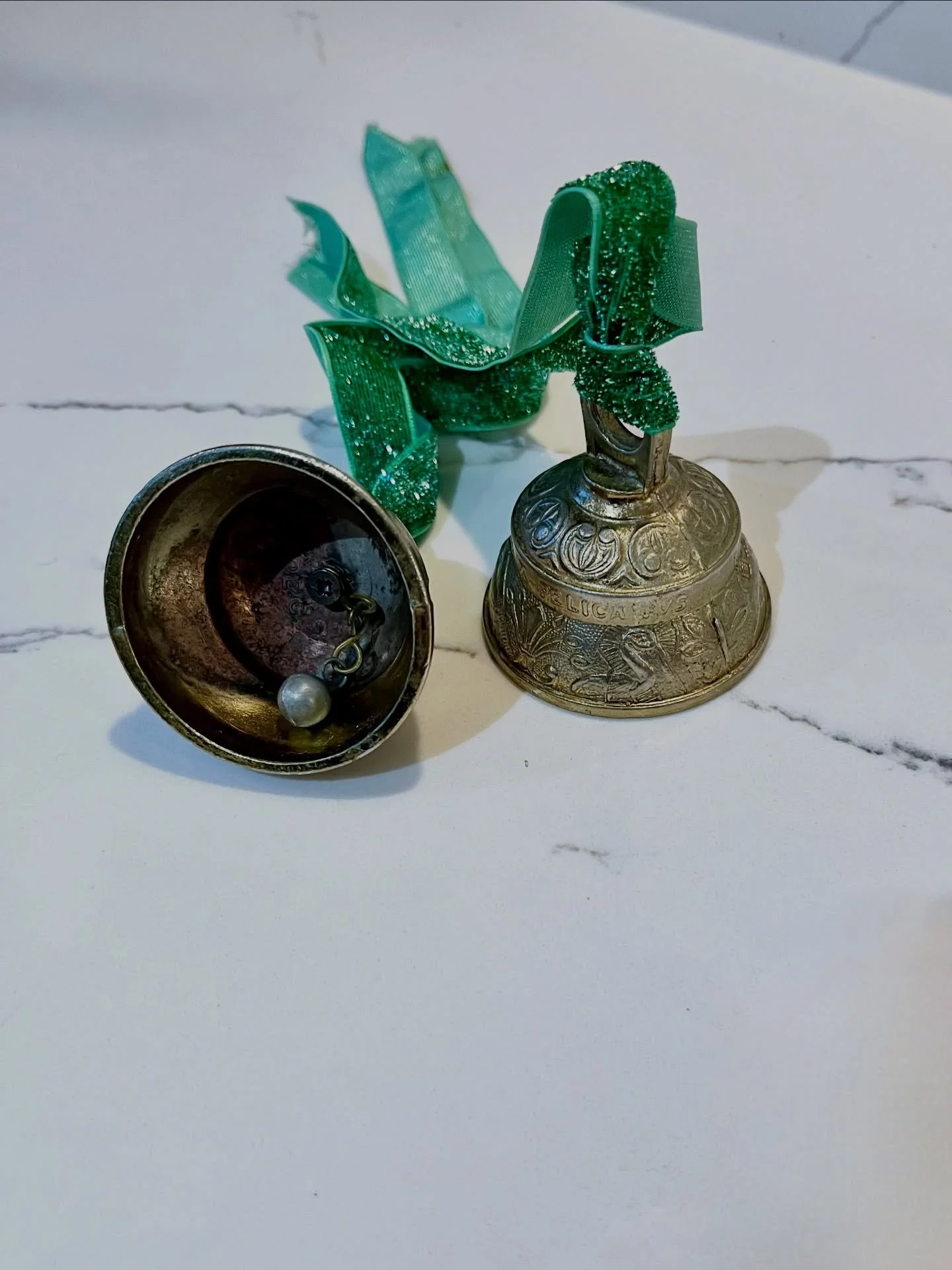 Two Sanctuary bells, also known as altar or Sanctus bells.
The ringing expresses adoration, thanks, and the presence of God, creating a &ldquo;joyful noise&rdquo;.
Embossed decorations featuring images of animals and birds; Agnvs (The Lamb), Leo (The
